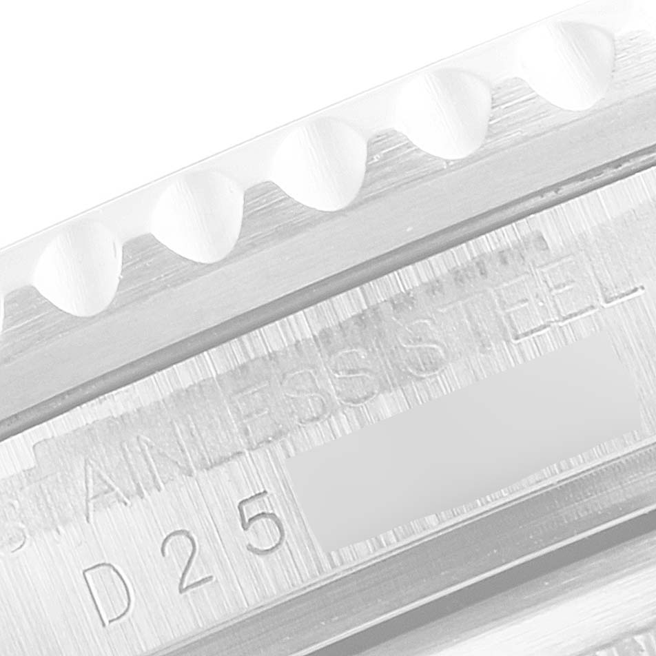 This image shows a close-up of the engraved stainless steel case of a Rolex GMT-Master 16710 Men
s Stainless Steel Black Dial 16710 Men
s Stainless Steel Black Dial watch.