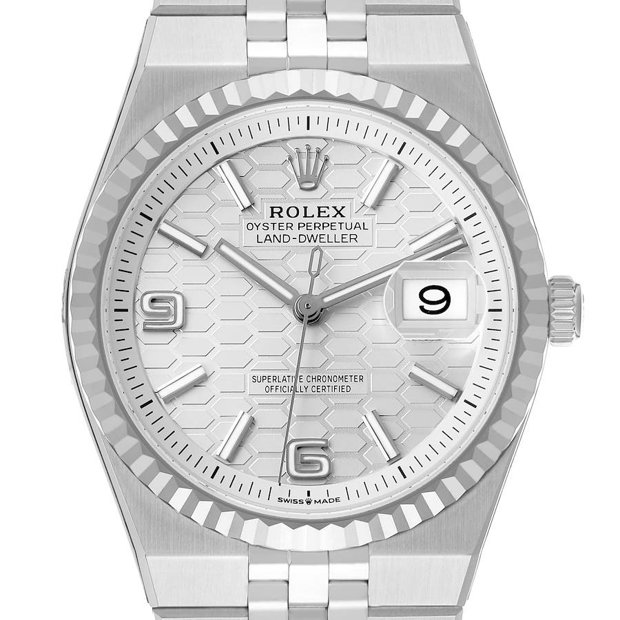 The image shows a front view of the Rolex Land-Dweller watch, including its dial, bezel, and bracelet.