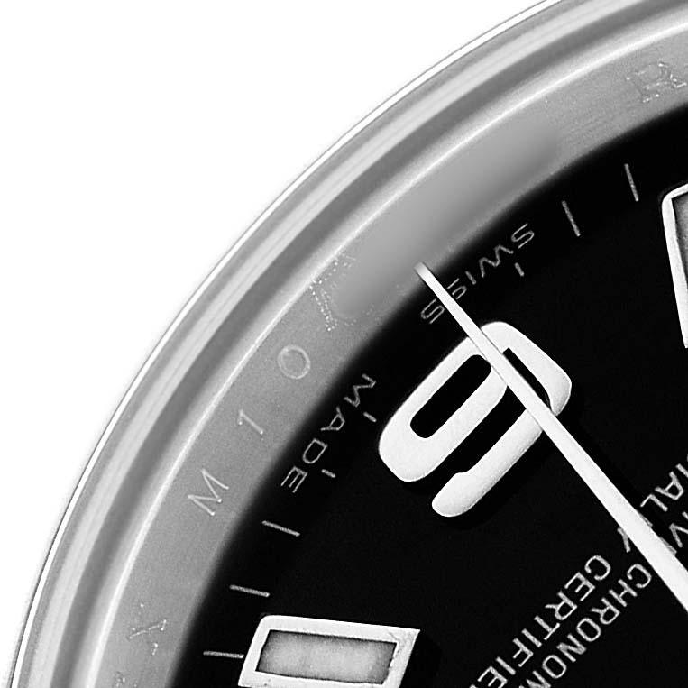 The image shows a close-up of the dial and bezel edge of a Rolex Oyster Perpetual 176200 Women's Stainless Steel Black Dial watch.