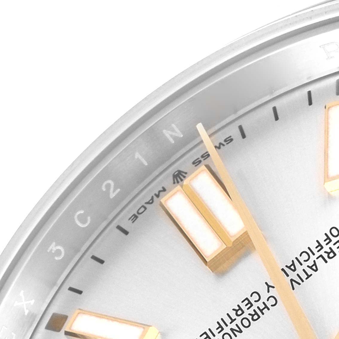 The image shows a close-up of the dial and bezel of a Rolex Oyster Perpetual 124300 Men's Stainless Steel Silver Dial 124300 Men's Stainless Steel Silver Dial watch, highlighting the hour markers.