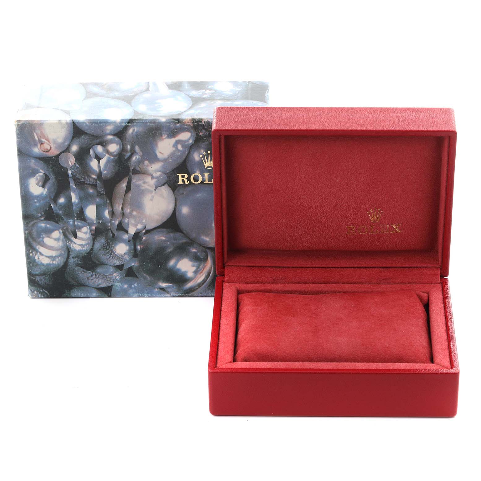 The image shows an empty Rolex red watch box and decorative outer packaging for the Oyster Perpetual model.