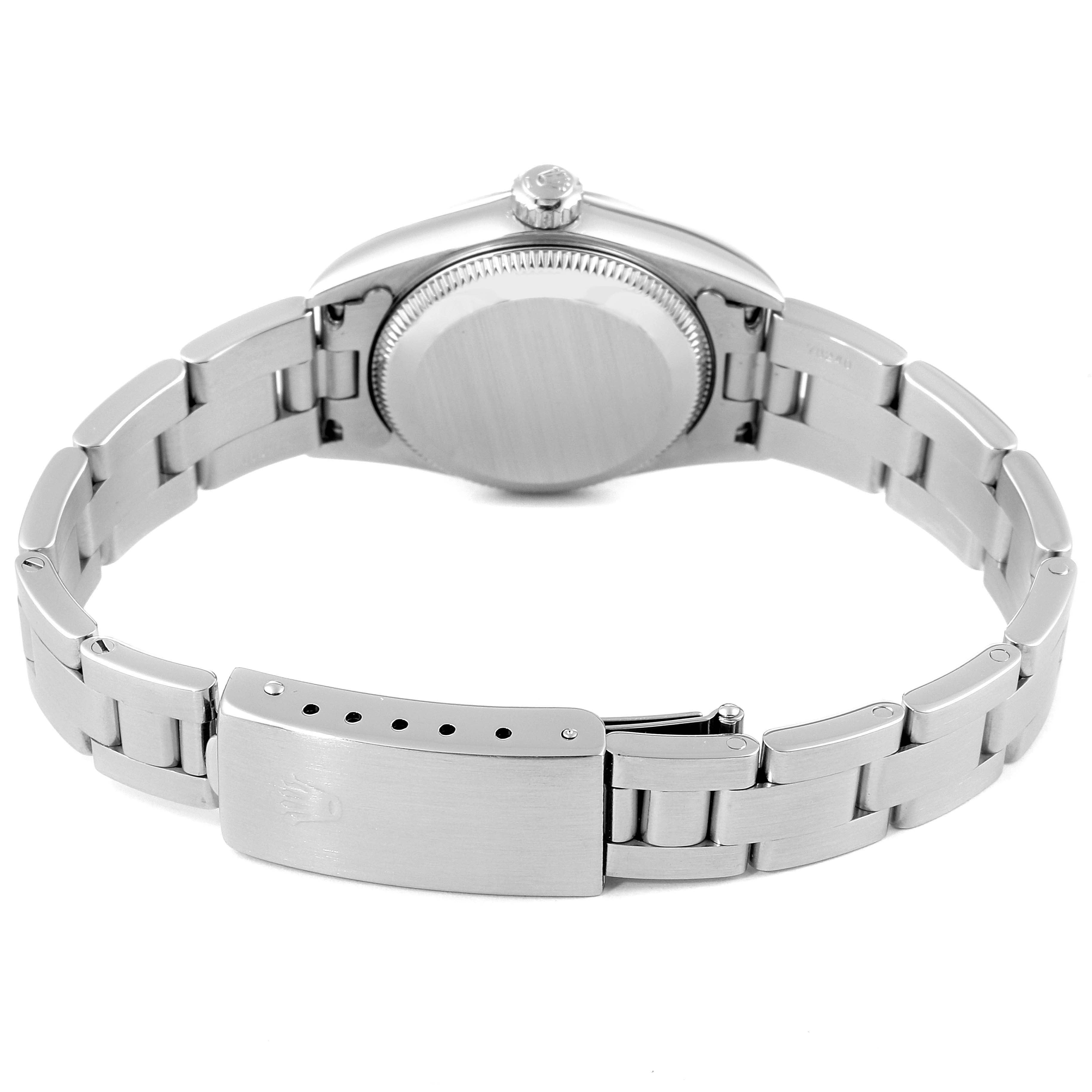 The image shows the back case and bracelet of the Rolex Oyster Perpetual 76094 Women
s Stainless Steel Blue Dial 76094 Women
s Stainless Steel Blue Dial watch.