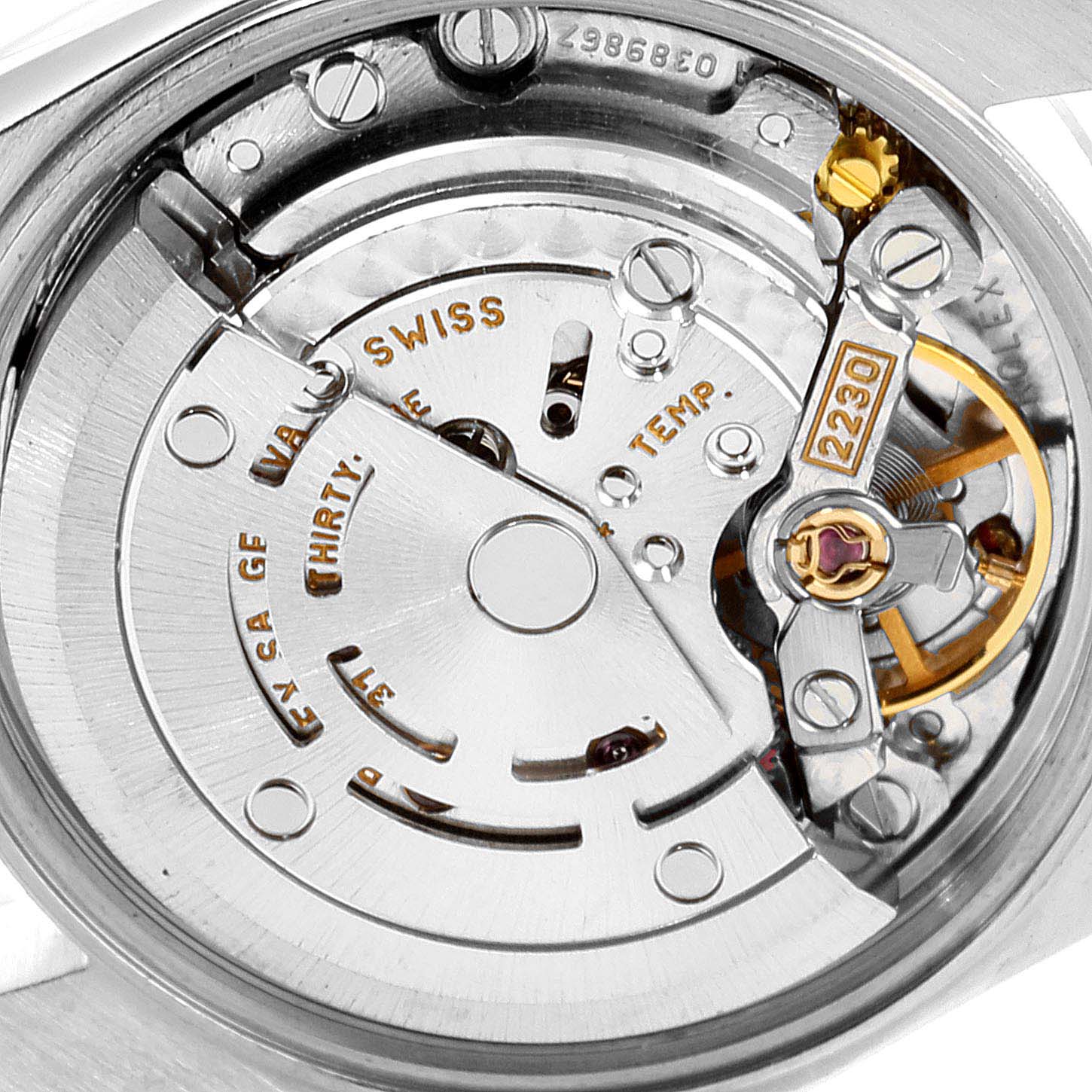 The image shows a close-up view of the movement mechanism of a Rolex Oyster Perpetual 76094 Women
s Stainless Steel Blue Dial 76094 Women
s Stainless Steel Blue Dial watch.