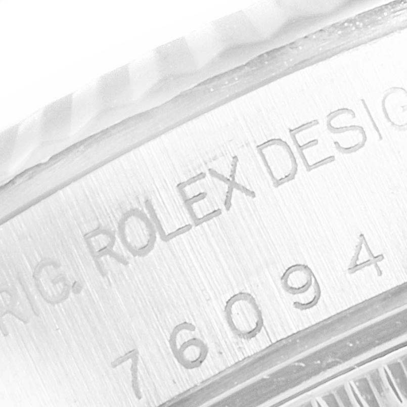 This close-up image shows the engraved model and design details on the caseback of a Rolex Oyster Perpetual 76094 Women
s Stainless Steel Blue Dial 76094 Women
s Stainless Steel Blue Dial watch.