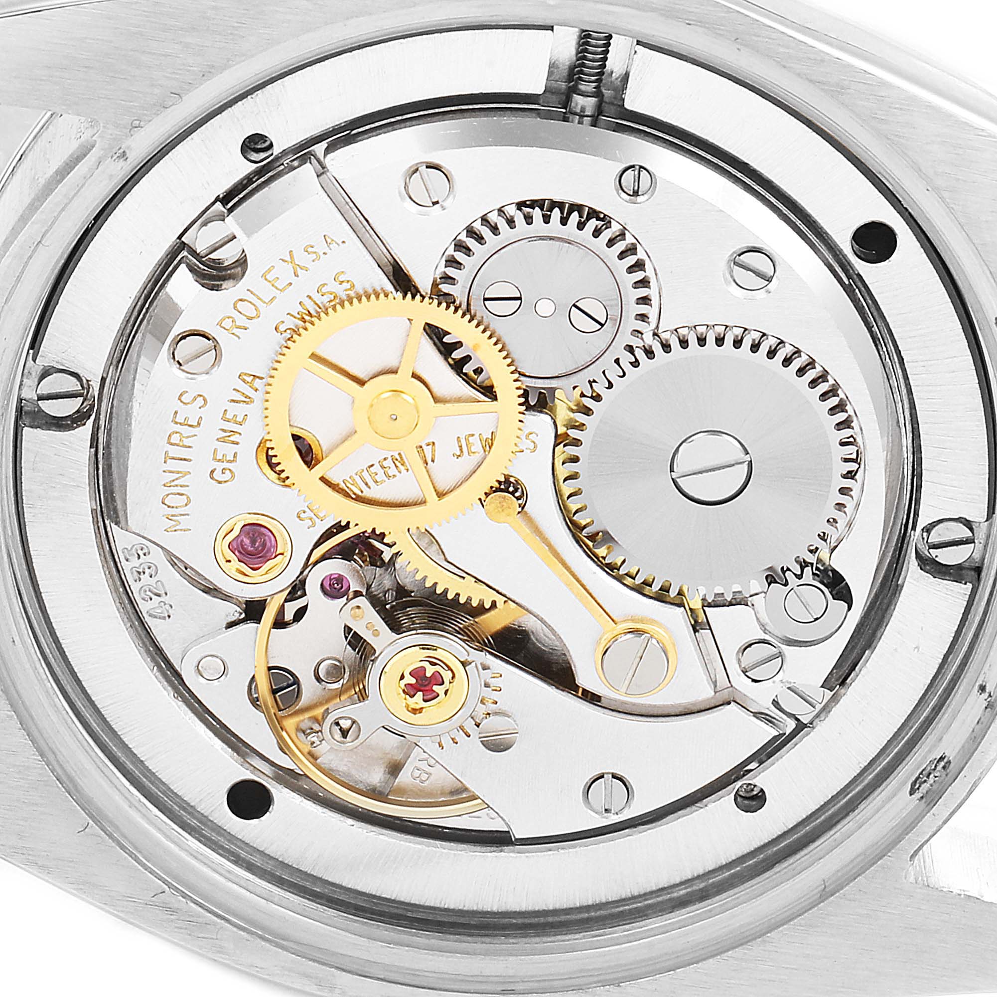 This image shows the intricate internal mechanism and parts of a Rolex Vintage Collection 6694 Men's Stainless Steel Black Dial 6694 Men's Stainless Steel Black Dial watch from a back angle view.