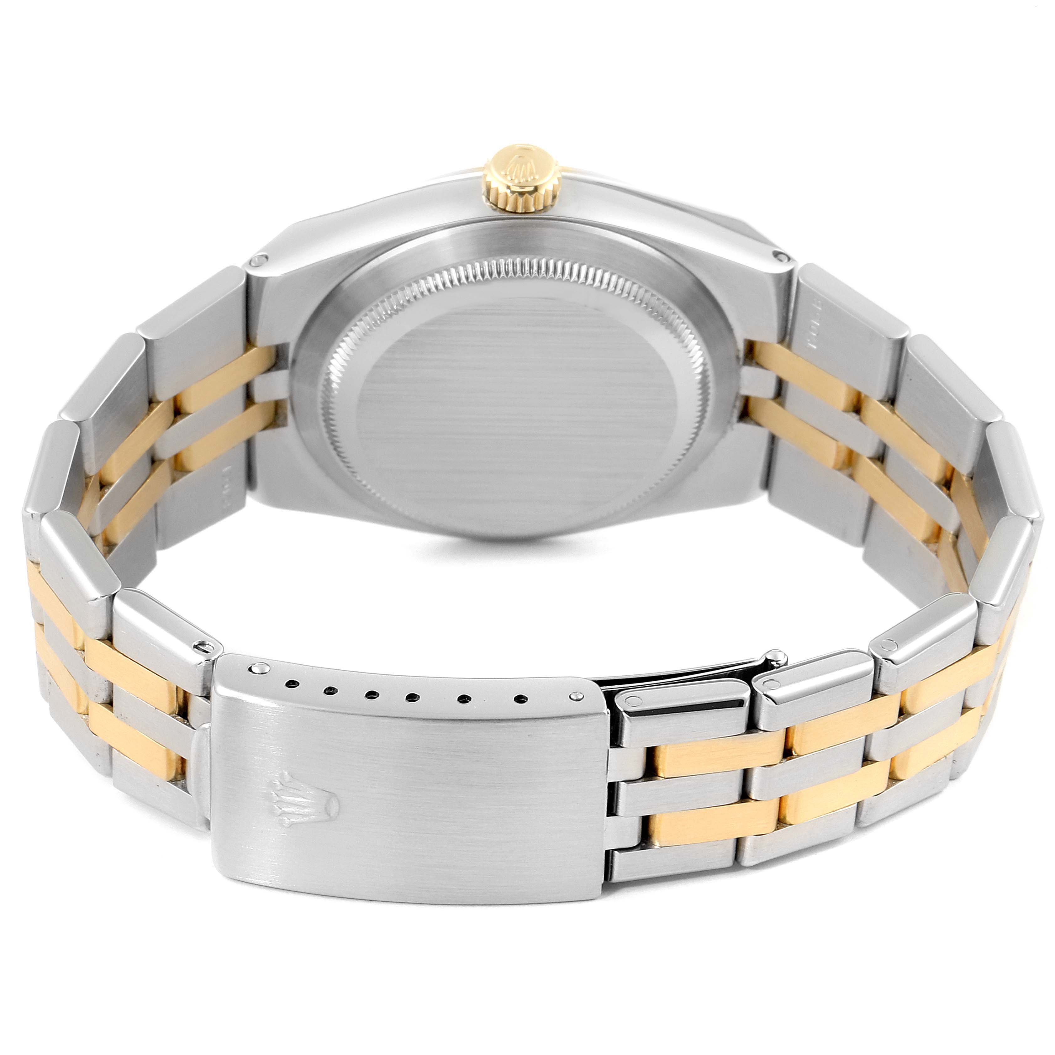 The image shows the back case, crown, and bracelet clasp of a Rolex Oysterquartz 17013 Men's Steel and Gold (two tone) Champagne Dial 17013 Men's Steel and Gold (two tone) Champagne Dial watch, highlighting its two-tone metal design.