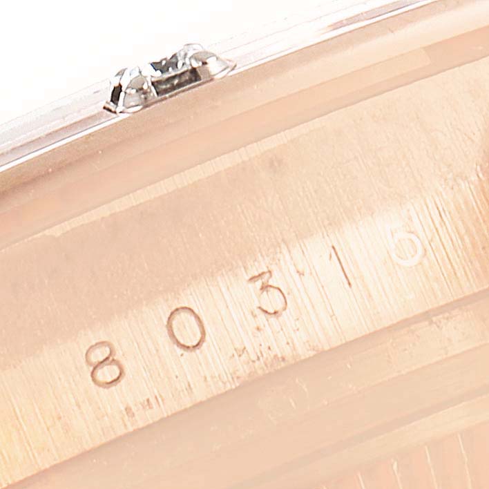 The image shows a close-up of the case side and serial number of a Rolex Pearlmaster 80315 Women's Rose Gold Brown Dial 80315 Women's Rose Gold Brown Dial watch.