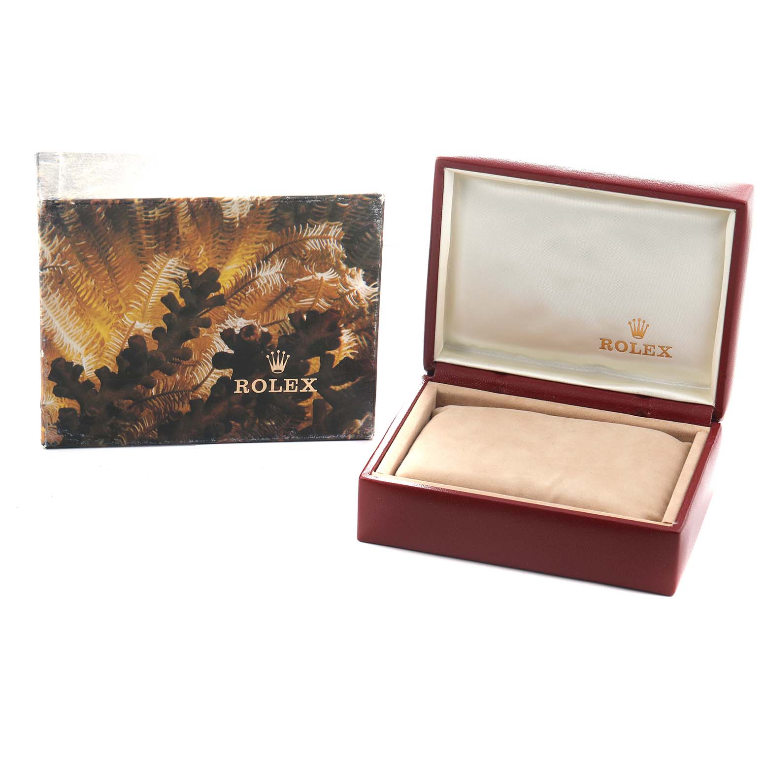 The image shows an open Rolex watch box for the President model, along with its decorative outer packaging.