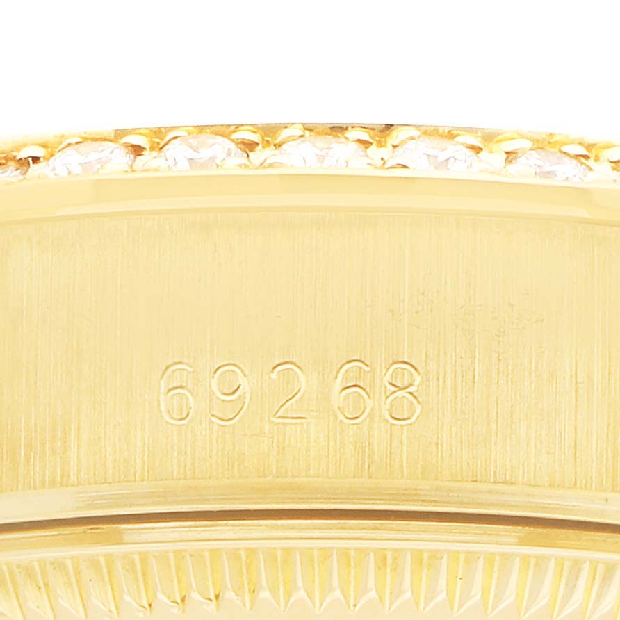 The image shows a close-up of the side of a Rolex President 69268 Women's Yellow Gold Champagne Dial watch, highlighting the engraved model number 69268.