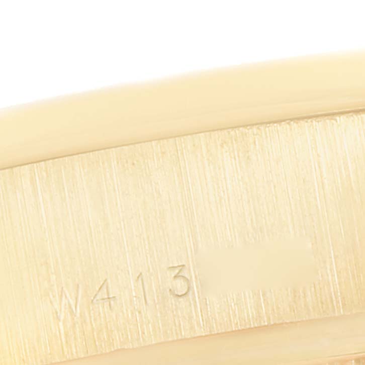 Close-up of the serial number on the gold band of a Rolex President 69288 Women's Yellow Gold Mother of Pearl Dial 69288 Women's Yellow Gold Mother of Pearl Dial model.