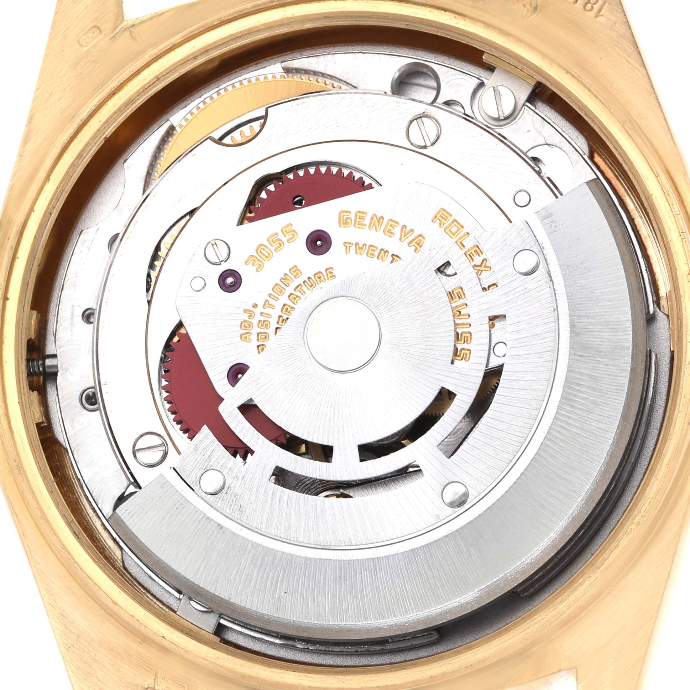 The image shows the internal mechanism of the Rolex President 18038 Men's Yellow Gold Champagne Dial watch, focusing on the movement and gears from a top-down angle.