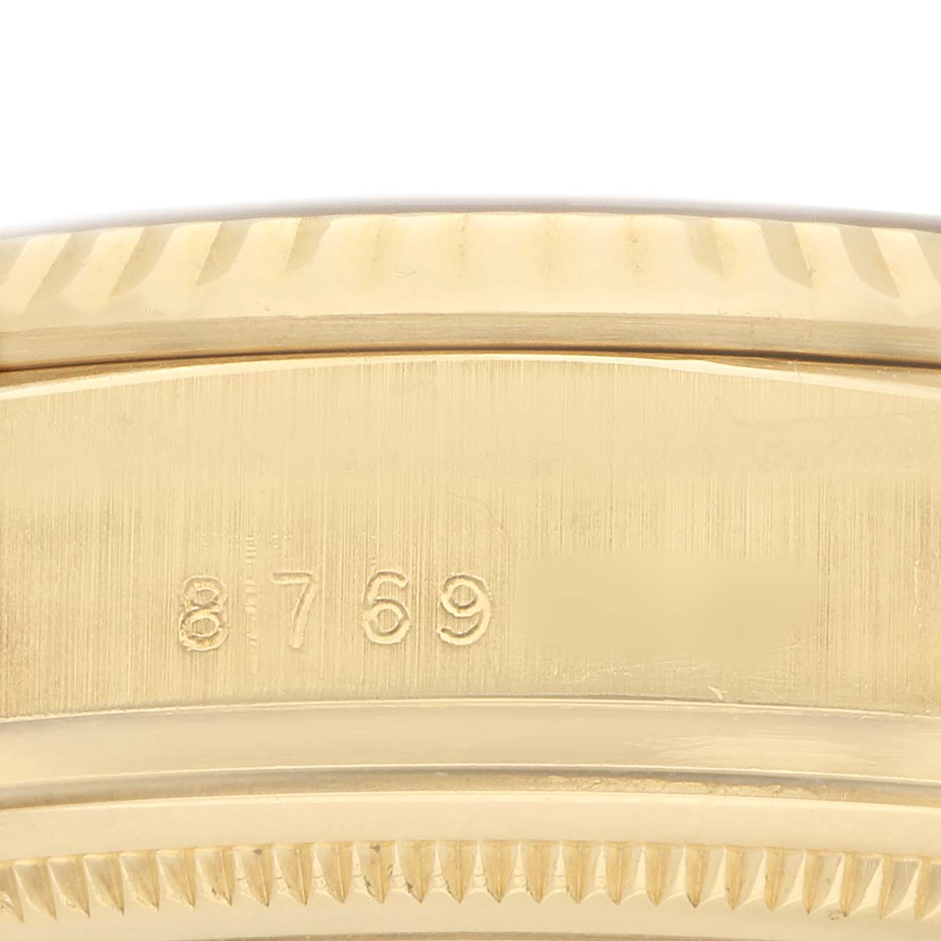 The image shows a close-up of the side of a Rolex President 18038 Men's Yellow Gold Champagne Dial watch case, highlighting the model number engraving.