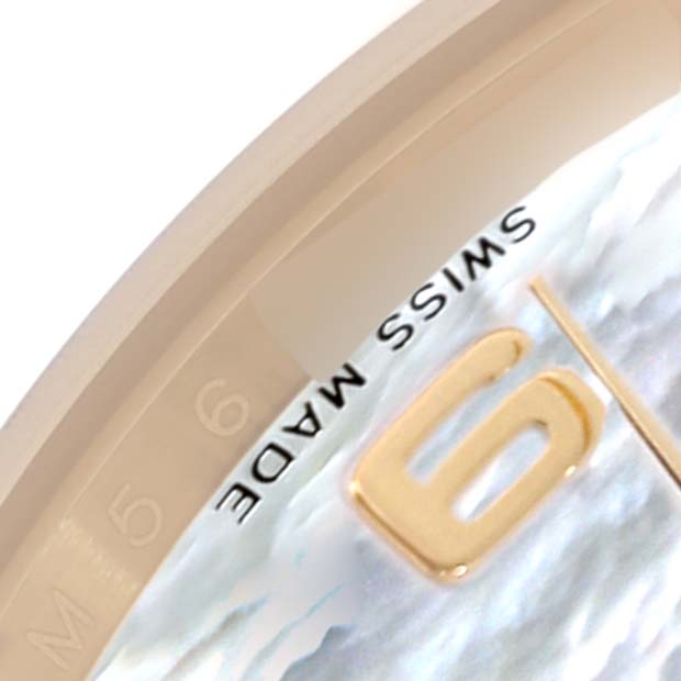 The image shows a close-up of the dial edge and number "6" on a Rolex President 118208 Men
s Yellow Gold Mother of Pearl Dial 118208 Men
s Yellow Gold Mother of Pearl Dial watch, emphasizing "SWISS MADE."