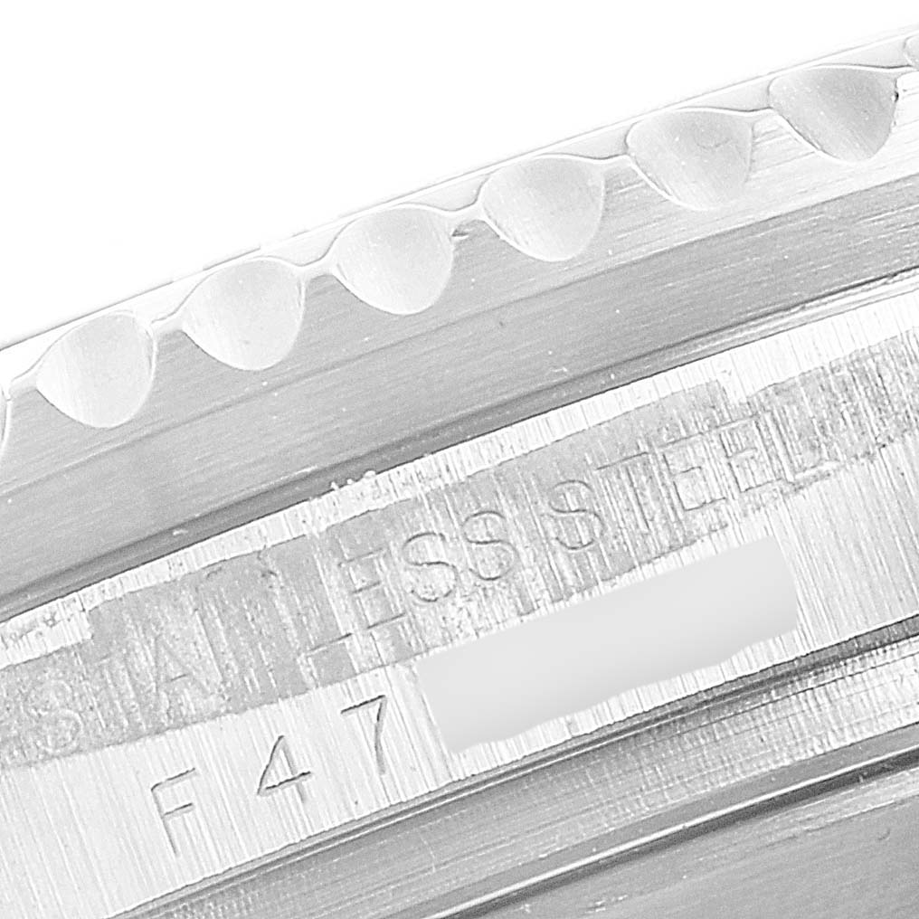 This close-up image shows the side of the bezel and the engraved details on the case of a Rolex Sea-Dweller 16600 Men's Stainless Steel Black Dial 16600 Men's Stainless Steel Black Dial watch.