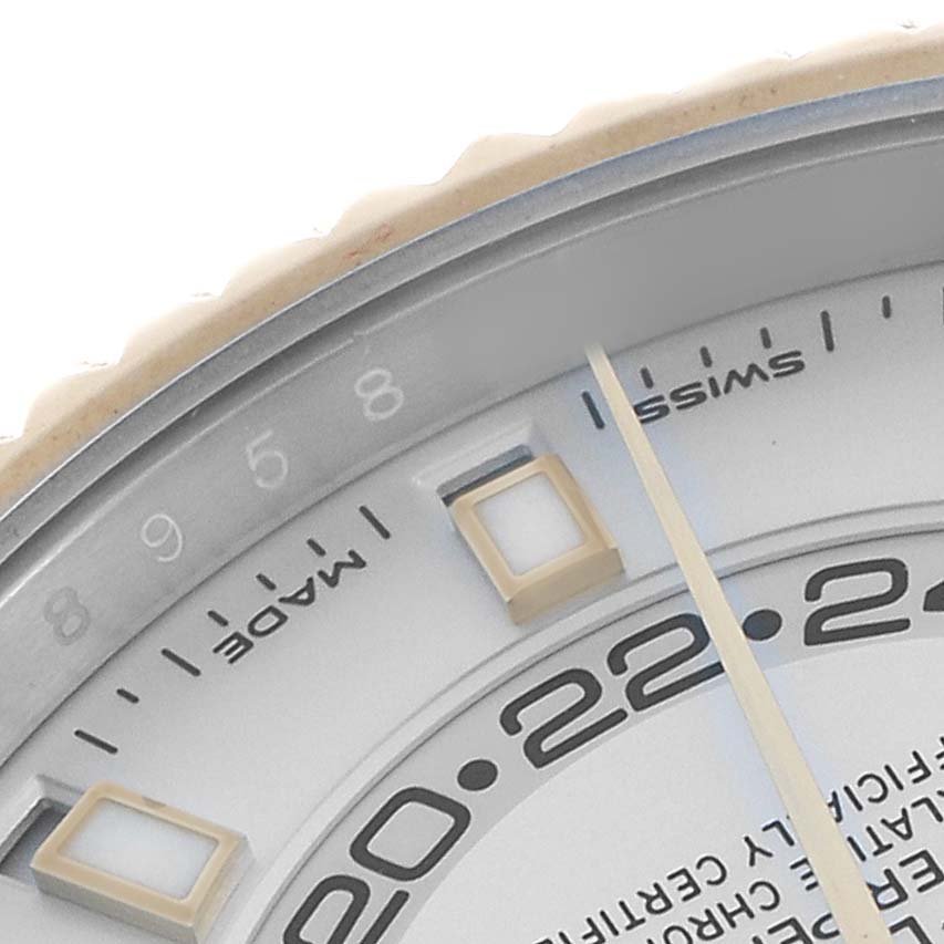 The image shows a close-up of the dial on the Rolex Sky-Dweller 326933 Men's Steel and Gold (two tone) White Dial, featuring part of the bezel, hour markers, and part of the hour hand.