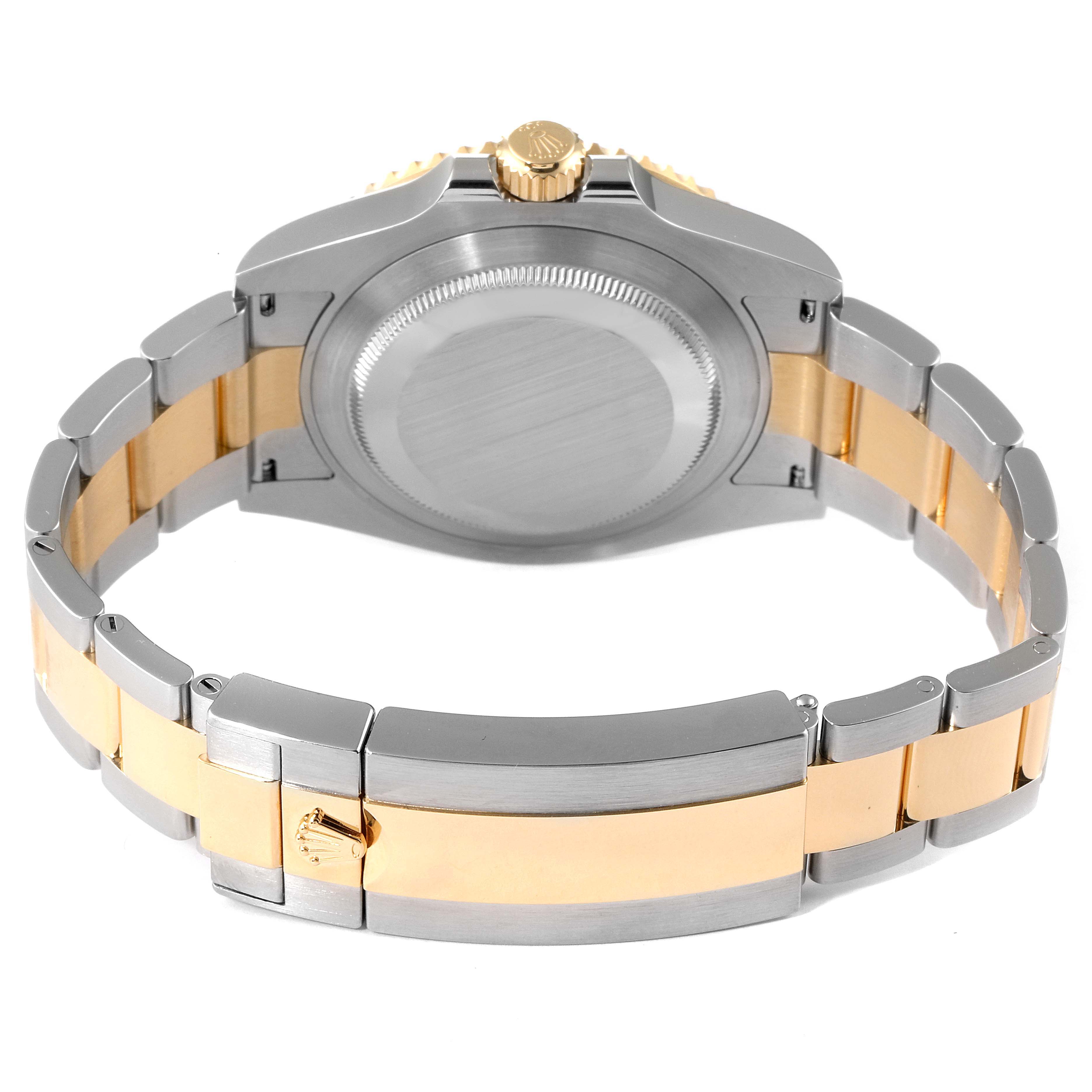 The image shows the back view of a Rolex Submariner 126613LB Men's Steel and Gold (two tone) Blue Dial 126613LB Men's Steel and Gold (two tone) Blue Dial watch, highlighting its caseback, bracelet, and clasp.