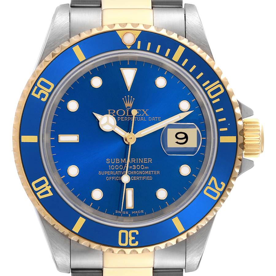 The image shows a front view of the Rolex Submariner, highlighting its blue dial, gold and silver bezel, and date window.