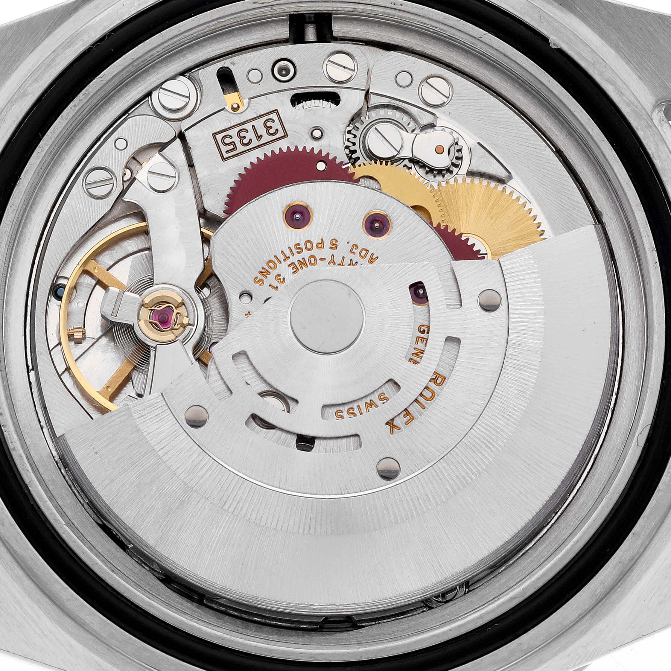 The image shows the inner mechanism of a Rolex Submariner 16613 Men's Steel and Gold (two tone) Blue Dial 16613 Men's Steel and Gold (two tone) Blue Dial, highlighting gears and the movement assembly.