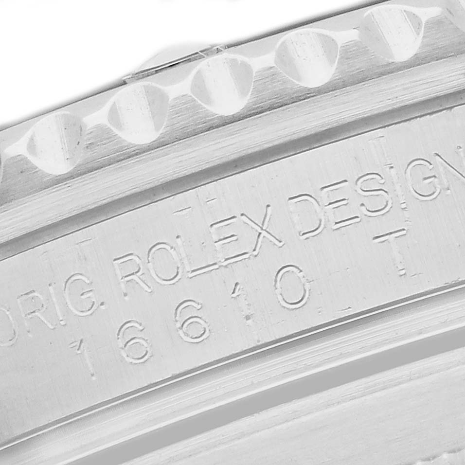 The image shows a close-up of the side engraving and bezel of a Rolex Submariner 16610 Men's Stainless Steel Black Dial, displaying model details.