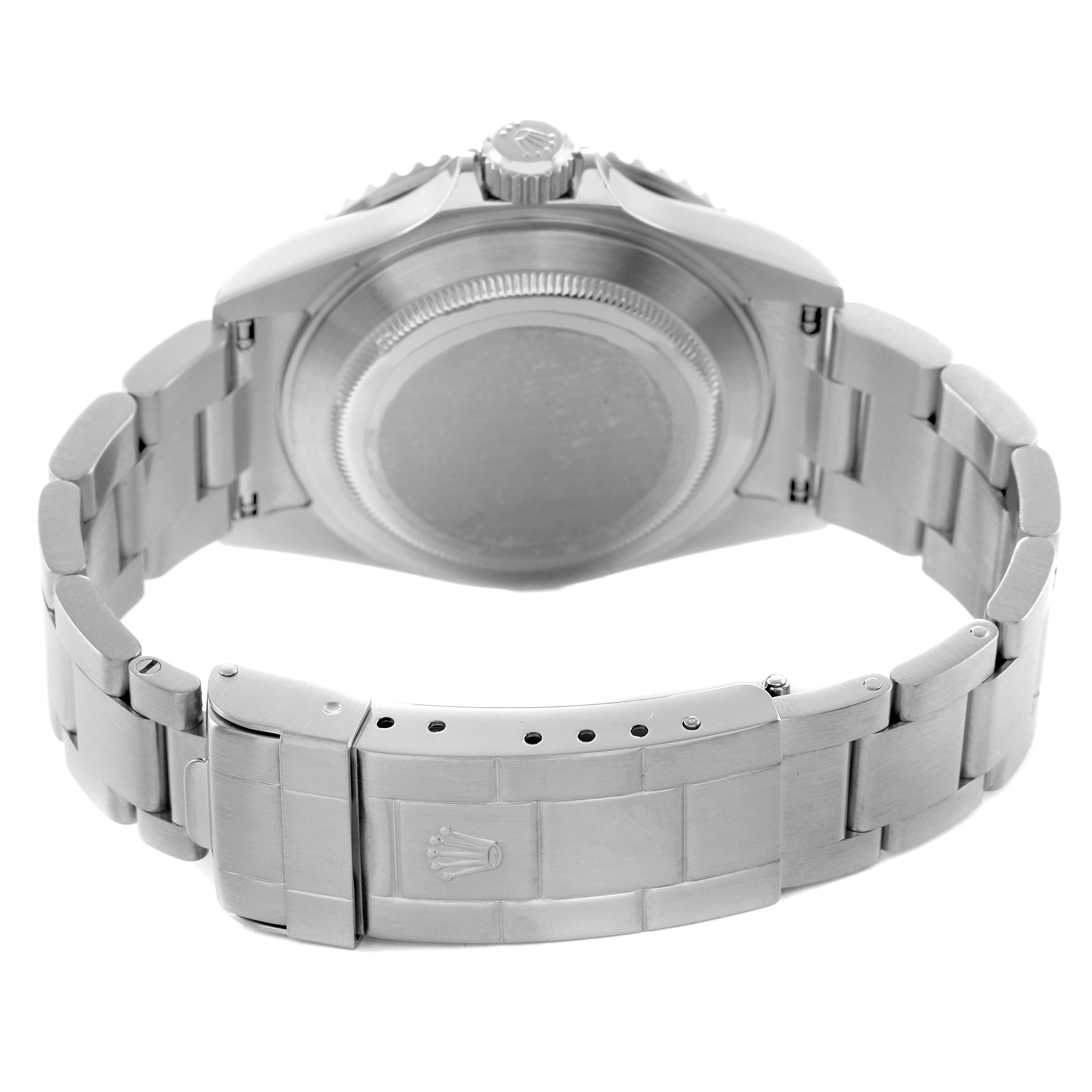 The image shows the back view of a Rolex Submariner 16610 Men's Stainless Steel Black Dial watch, highlighting its case back, bracelet, and clasp.