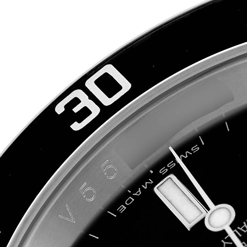 The image shows a close-up of the bezel and part of the dial of the Rolex Submariner 16610 Men's Stainless Steel Black Dial.