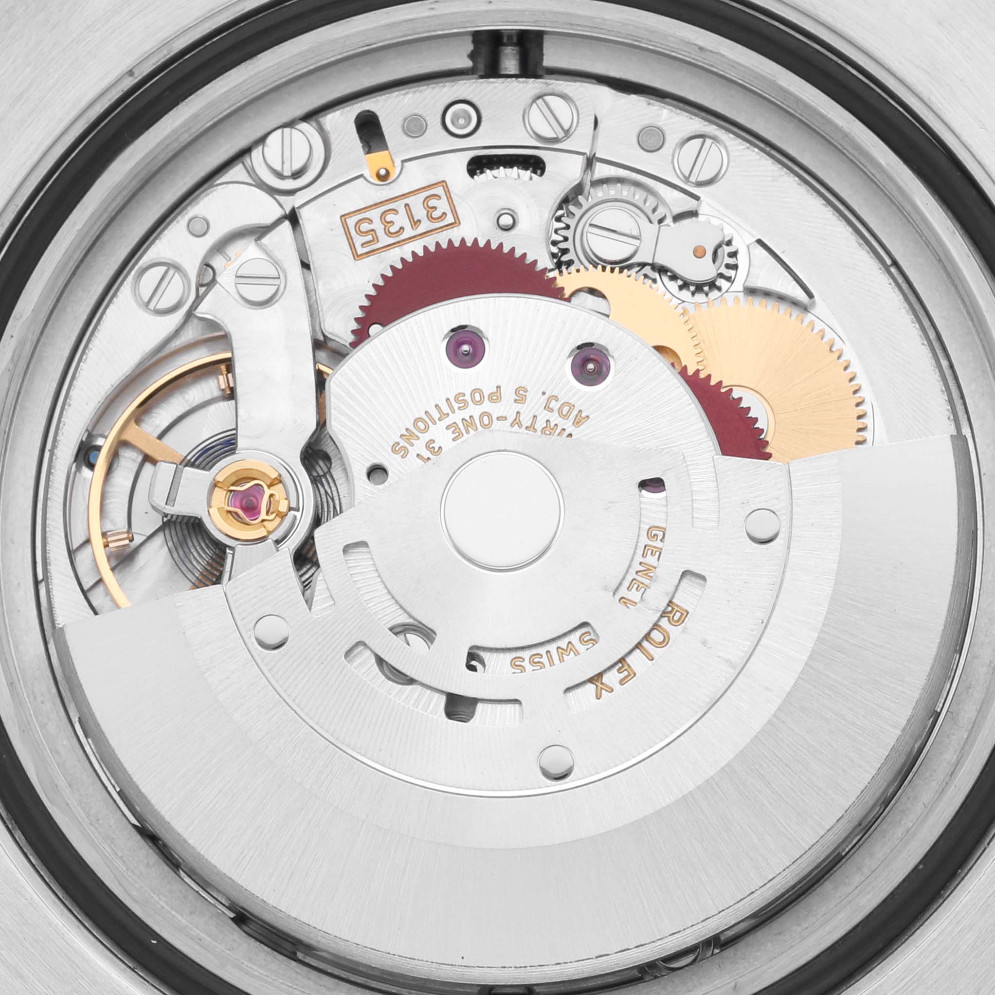 The image shows the intricate internal movement of a Rolex Submariner 116610LV Men's Stainless Steel Green Dial 116610LV Men's Stainless Steel Green Dial watch, featuring gears and rotors from an overhead angle.