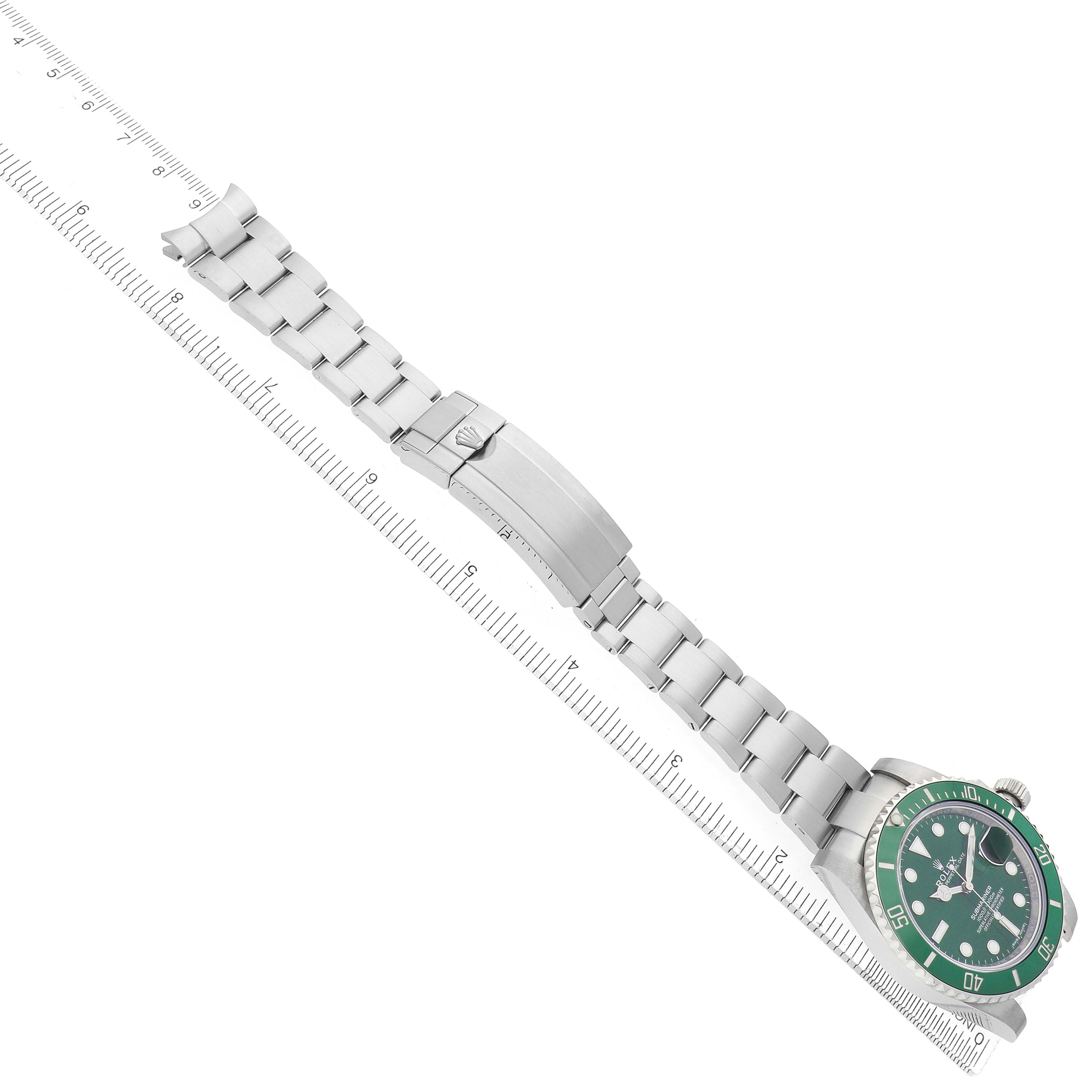 The Rolex Submariner 116610LV Men's Stainless Steel Green Dial is viewed from a side angle, showing the bracelet, clasp, and green bezel and dial.