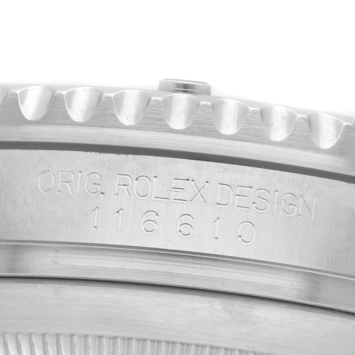 The image shows a close-up of the bezel edge and engraved side of a Rolex Submariner 116610LV Men's Stainless Steel Green Dial, focusing on the model number 116610.