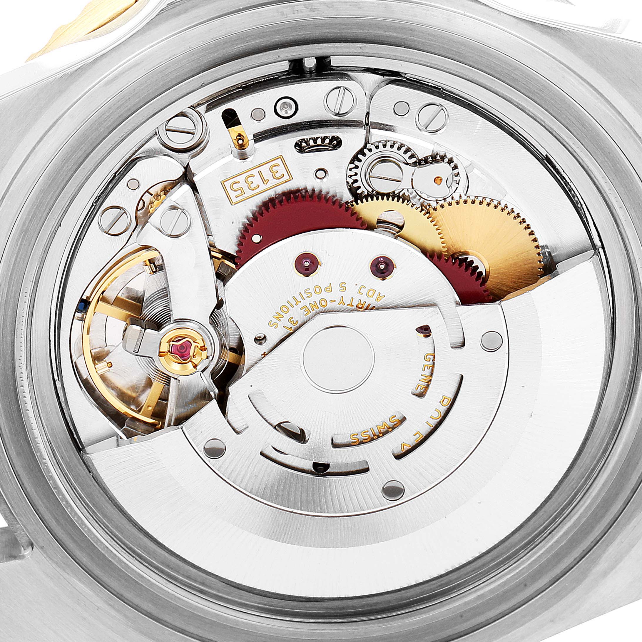 This image shows the internal mechanism of a Rolex Submariner 16613 Men's Steel and Gold (two tone) Champagne Dial 16613 Men's Steel and Gold (two tone) Champagne Dial watch from a back view, highlighting gears and components.