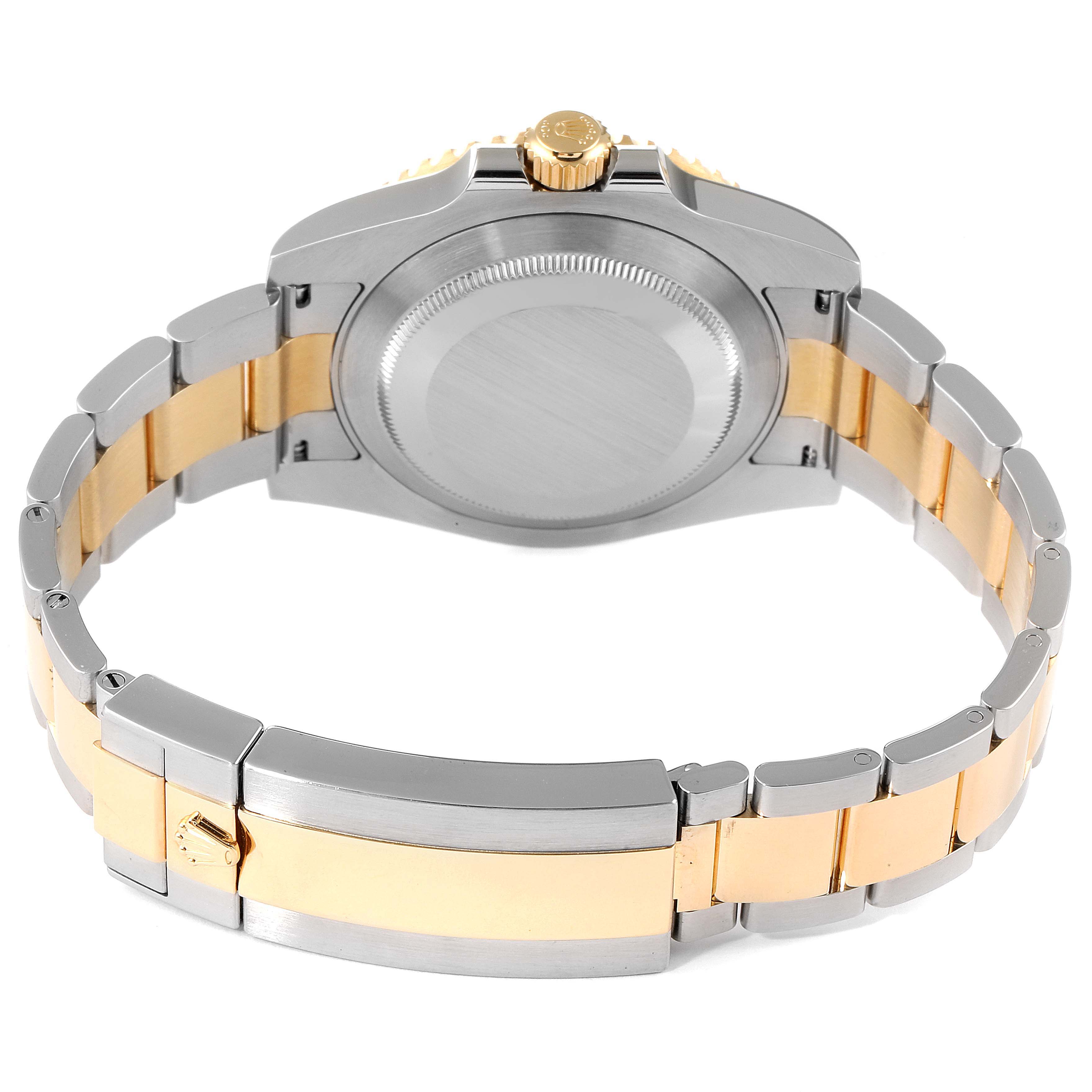 The image shows the back case, crown, and bracelet of a Rolex Submariner 116613 Men
s Steel and Gold (two tone) Blue Dial 116613 Men
s Steel and Gold (two tone) Blue Dial watch, displaying its two-tone metal design.