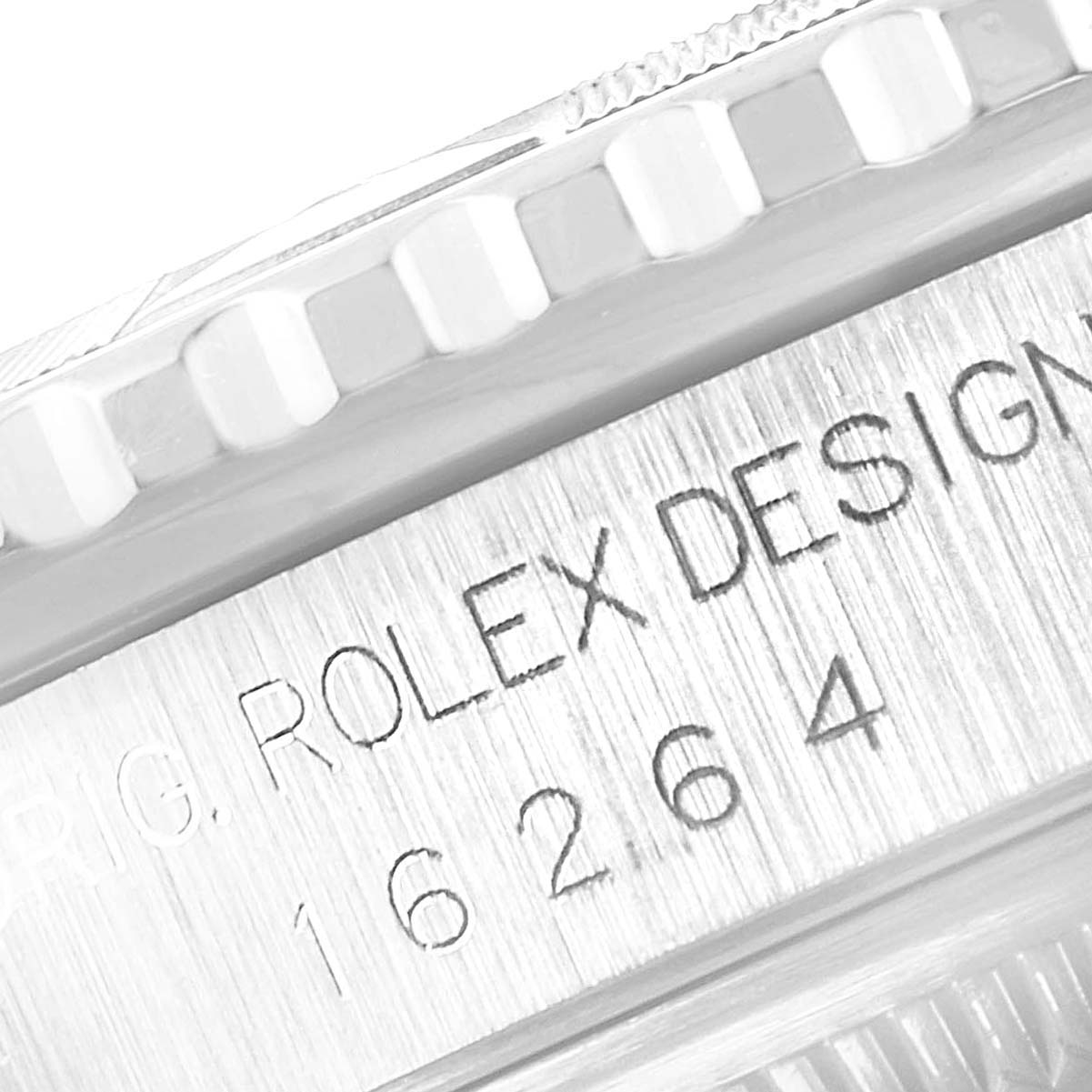 The image shows a close-up of the side of a Rolex Turn-o-Graph 16264 Men
s Stainless Steel Blue Dial 16264 Men
s Stainless Steel Blue Dial watch, highlighting the bezel and engraved serial number.