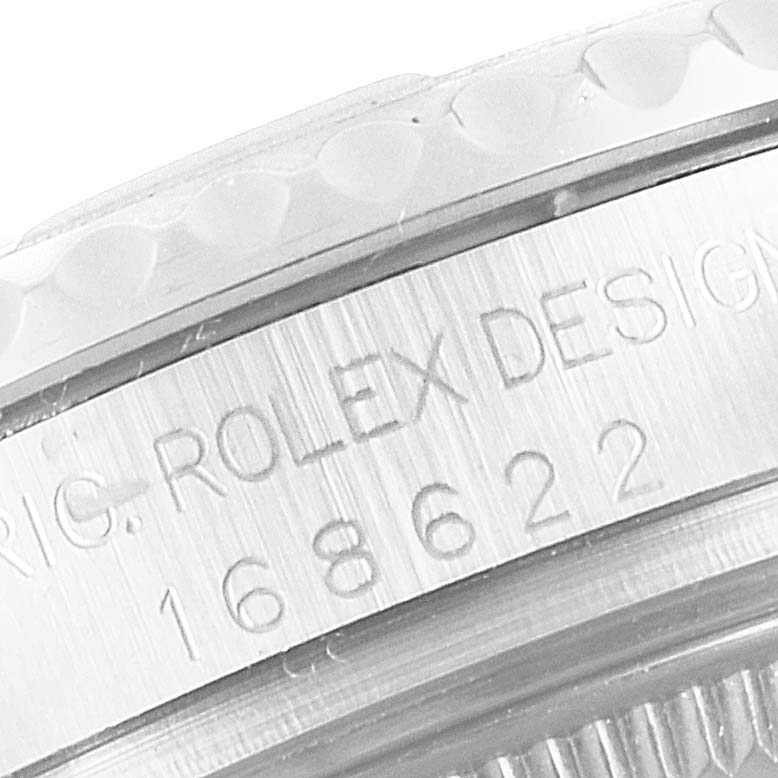 This close-up image shows the model number and design engraving on the bezel and case of a Rolex Yacht-Master 168622 Men's Stainless Steel Silver Dial 168622 Men's Stainless Steel Silver Dial watch.