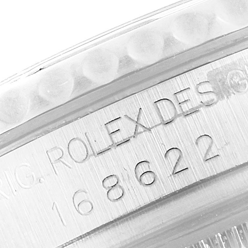 The image shows a close-up of the case side of a Rolex Yacht-Master 168622 Men
s Stainless Steel Silver Dial 168622 Men
s Stainless Steel Silver Dial watch, including the model number and "ROLEX DESIGN" engraving.