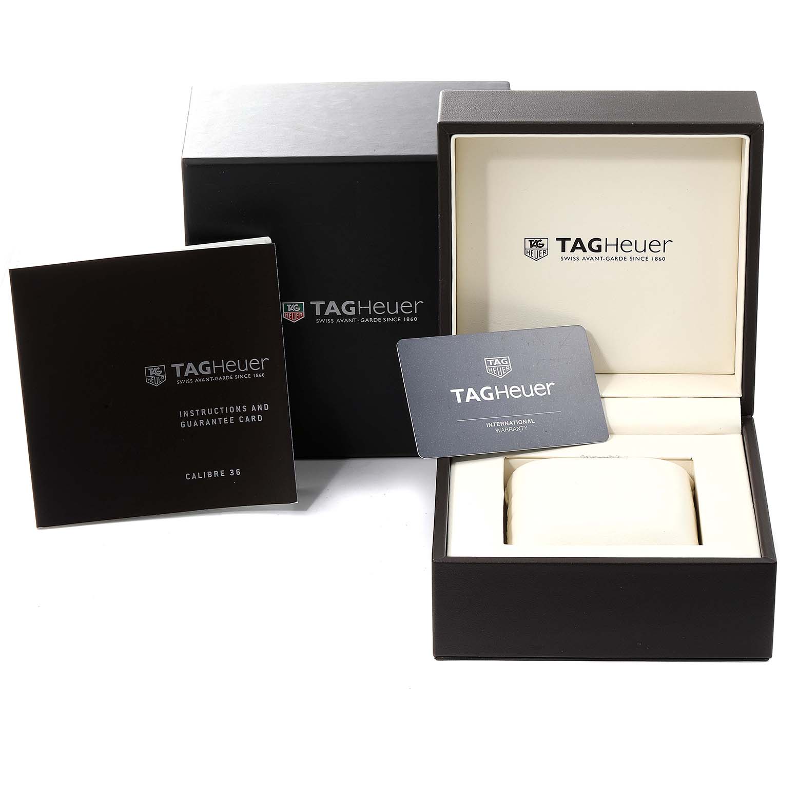 The image shows the packaging, instructions, and guarantee card for a Tag Heuer Carrera CAR2B80.FC6325 Men's Titanium Black Dial CAR2B80.FC6325 Men's Titanium Black Dial watch.