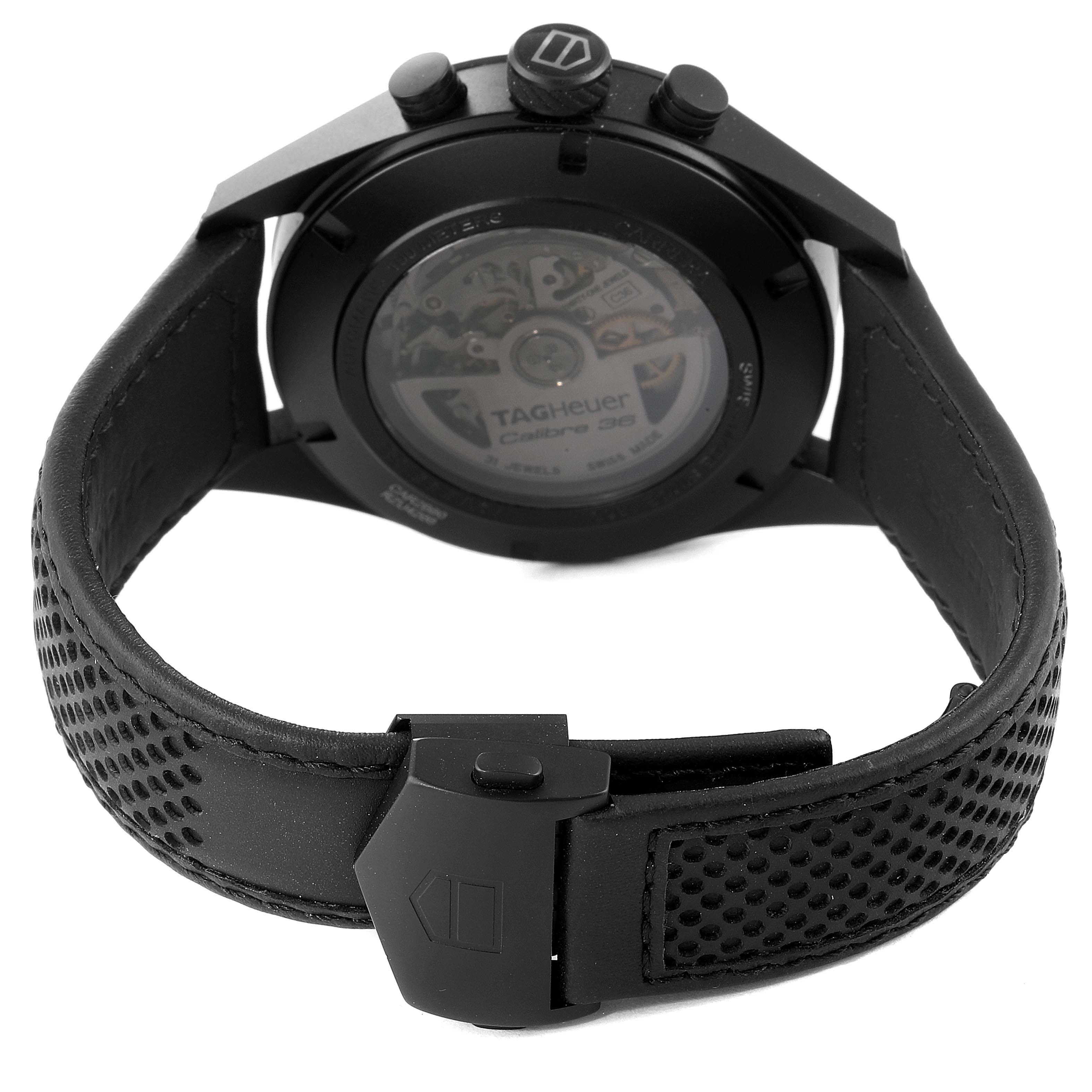 The image shows the back view of the Tag Heuer Carrera CAR2B80.FC6325 Men's Titanium Black Dial CAR2B80.FC6325 Men's Titanium Black Dial watch, displaying its transparent case back and clasp details.