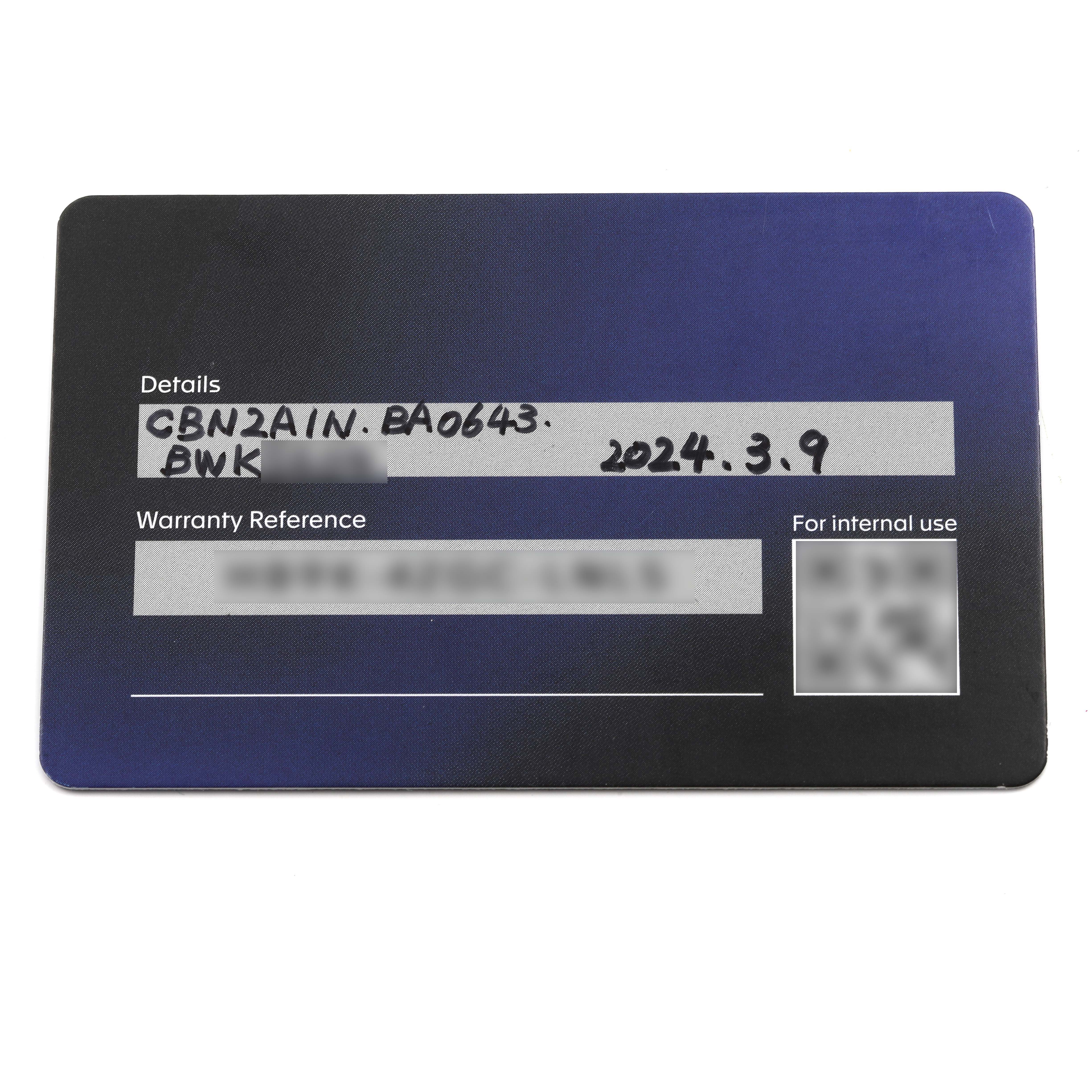 The image shows a warranty card for a Tag Heuer Carrera CBN2A1N.BA0643 Men's Stainless Steel Green Dial CBN2A1N.BA0643 Men's Stainless Steel Green Dial watch, featuring model details and a warranty reference.