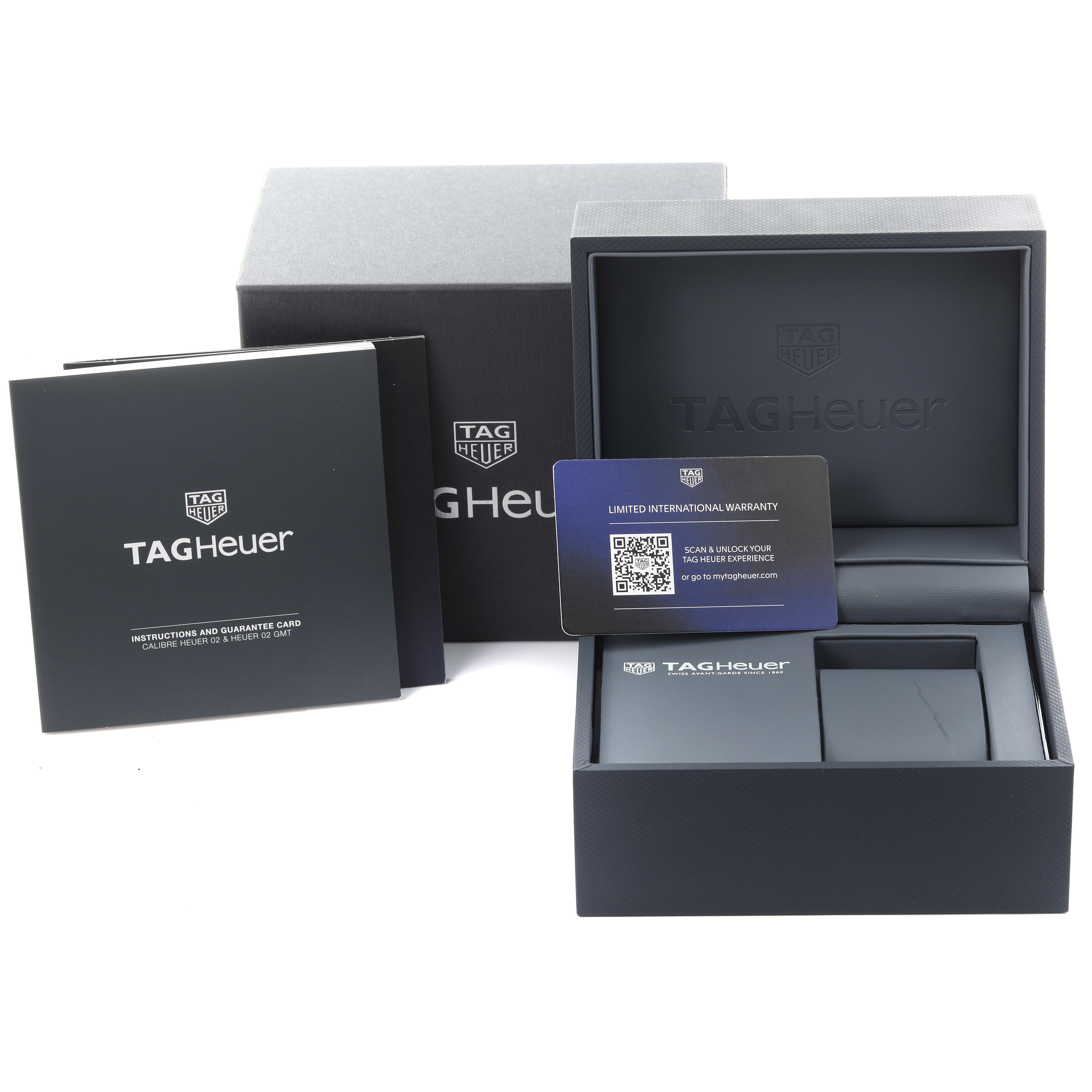 The image shows a Tag Heuer Carrera CBN2A1N.BA0643 Men's Stainless Steel Green Dial CBN2A1N.BA0643 Men's Stainless Steel Green Dial watch box, warranty card, and instruction booklet from a front angle.