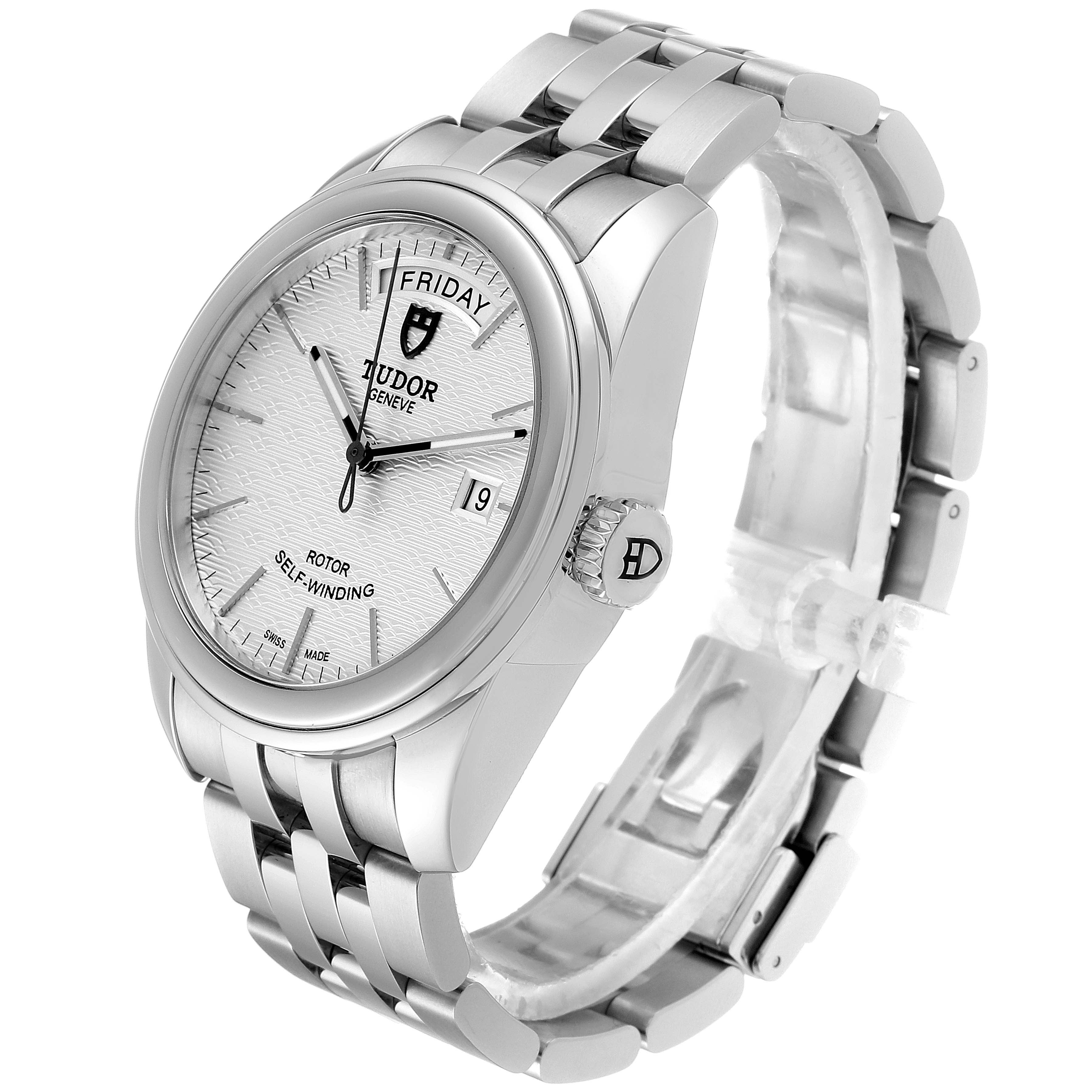 The image shows a side and front angle of a Tudor Glamour M56000-0008 Men's Stainless Steel Silver Dial M56000-0008 Men's Stainless Steel Silver Dial model watch, displaying its face, bracelet, and crown.