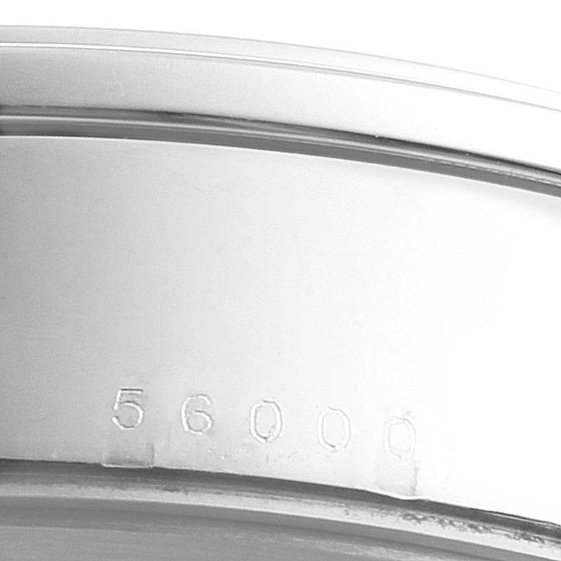 This image shows the partial underside of the case of a Tudor Glamour M56000-0008 Men's Stainless Steel Silver Dial M56000-0008 Men's Stainless Steel Silver Dial watch, featuring its model number engraving.
