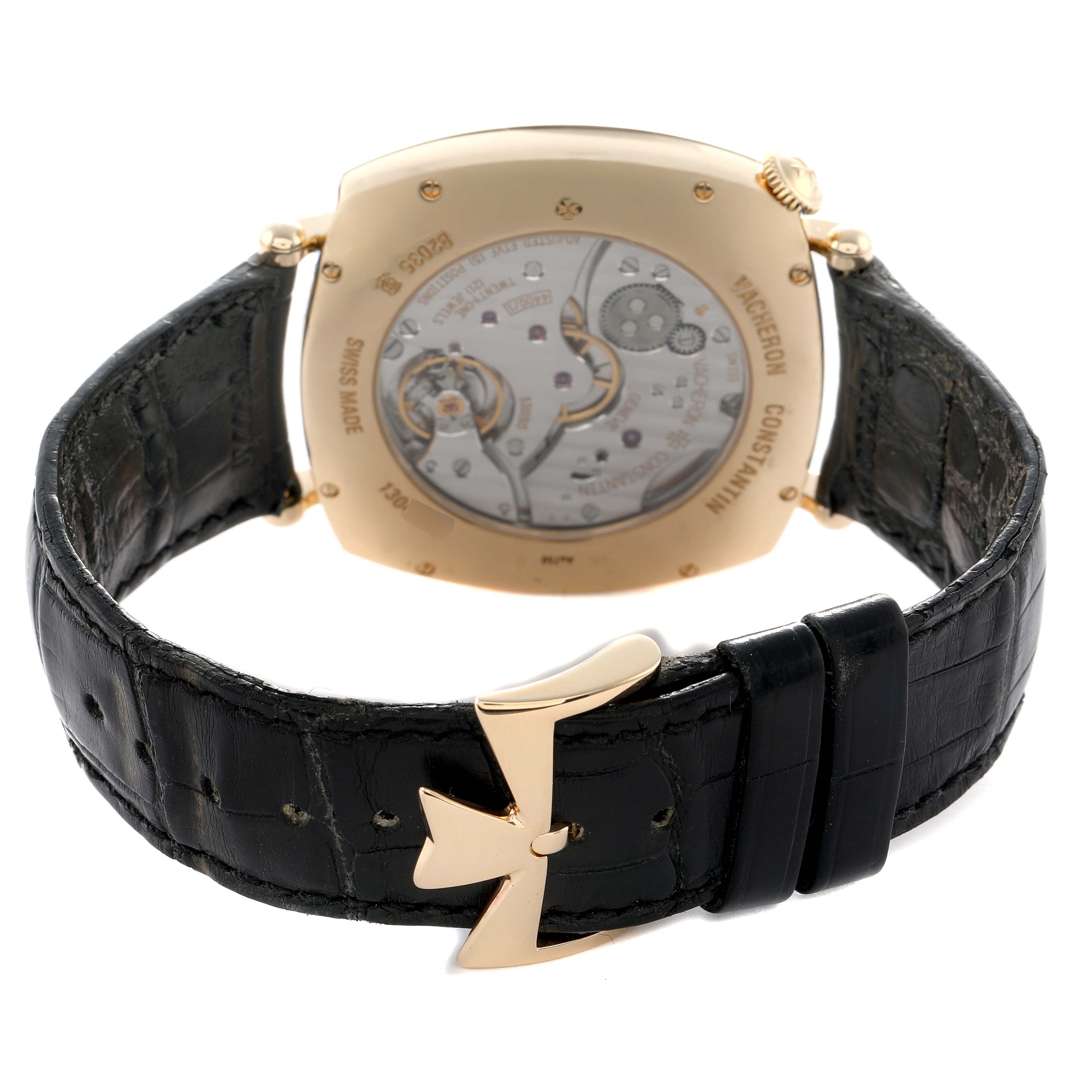 The Vacheron Constantin Historiques 82035 Men's Yellow Gold Silver Dial watch is shown from the back, highlighting its transparent case back and leather strap with clasp.