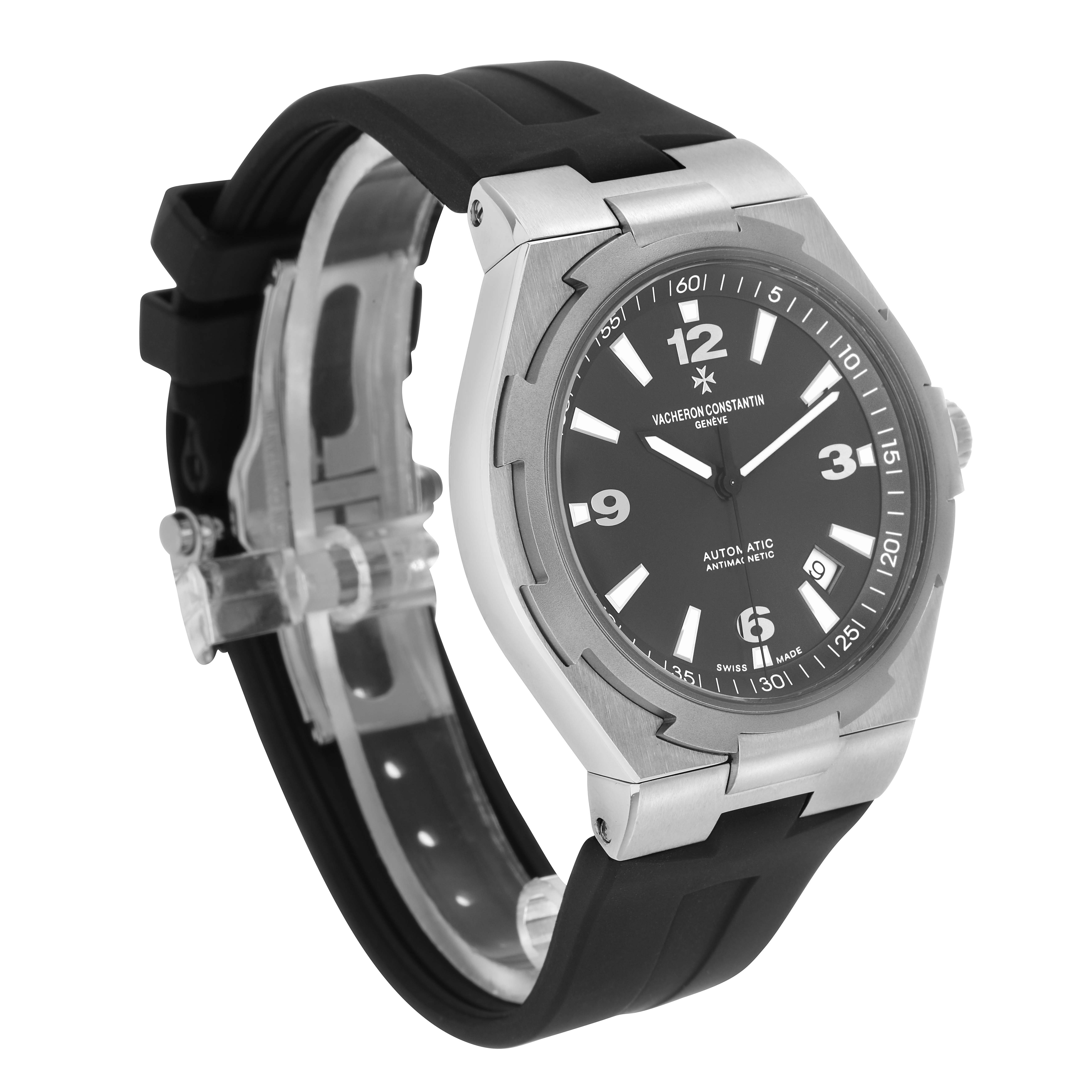 The Vacheron Constantin Overseas 47040 Men's Stainless Steel Grey Dial watch is shown at a three-quarter angle, displaying the case, dial, strap, and crown.