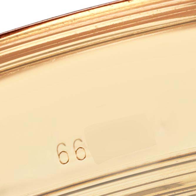 The image shows a close-up of the edge of a Vacheron Constantin Patrimony 30050/000J-7604 Men's Yellow Gold White Dial 30050/000J-7604 Men's Yellow Gold White Dial watch case with part of a serial number visible.