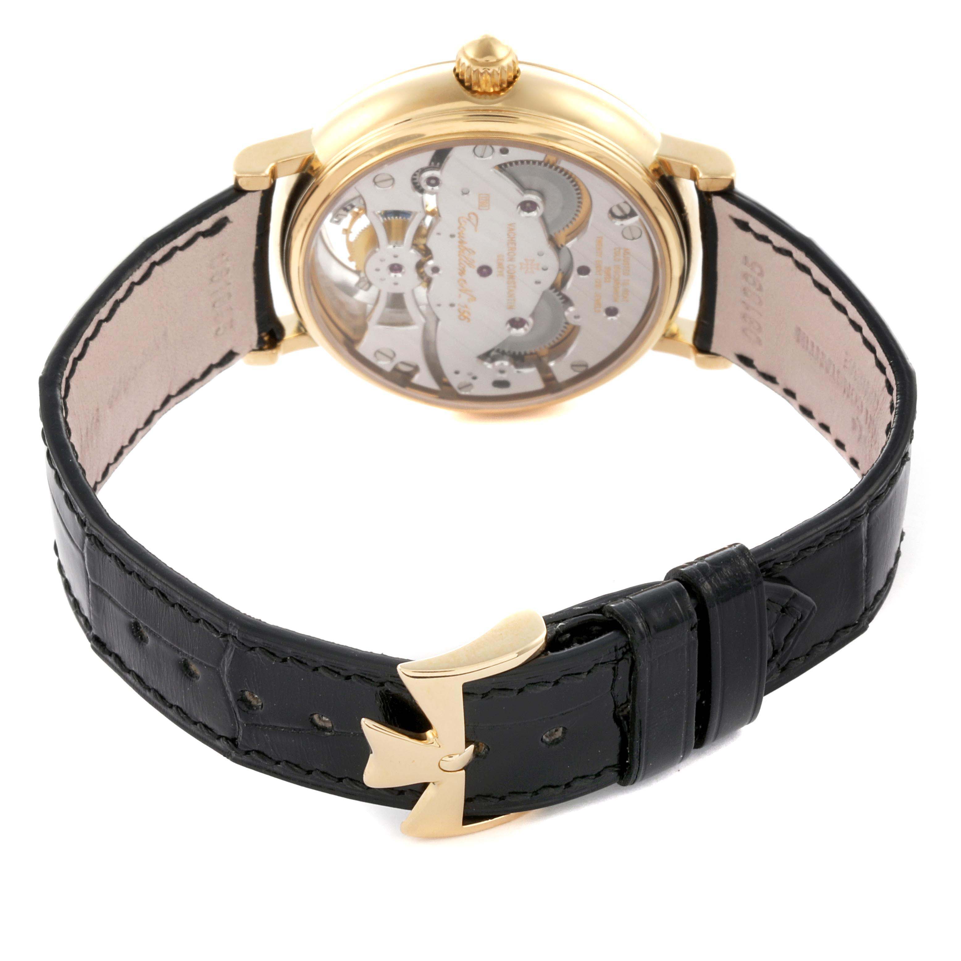 The Vacheron Constantin Patrimony 30050/000J-7604 Men's Yellow Gold White Dial 30050/000J-7604 Men's Yellow Gold White Dial watch is shown from the back, highlighting the transparent case back and black leather strap.