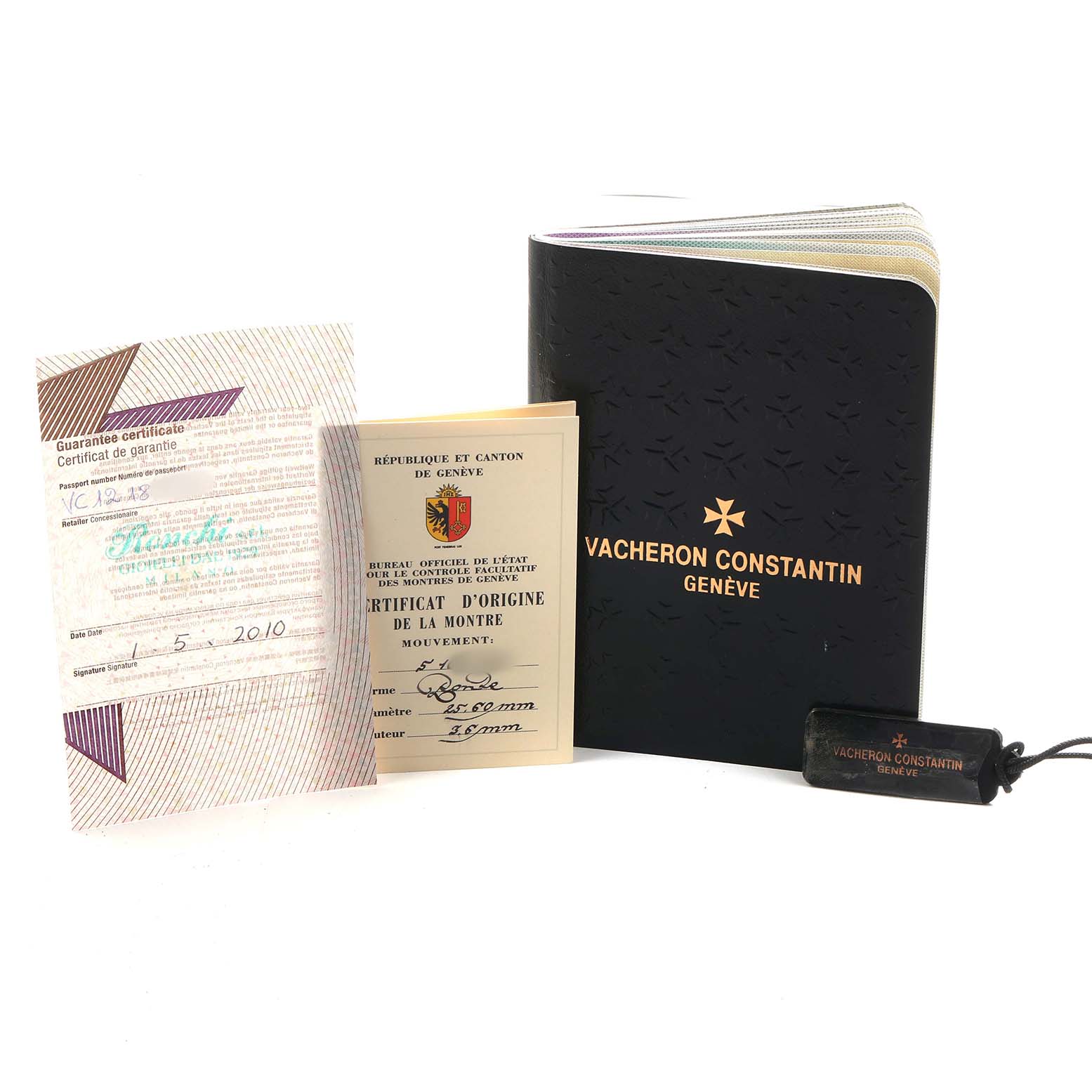 The image shows Vacheron Constantin Traditionnelle 87172 Men's Rose Gold Silver Dial watch documentation and accessories, including a booklet, certificates, and a tag.