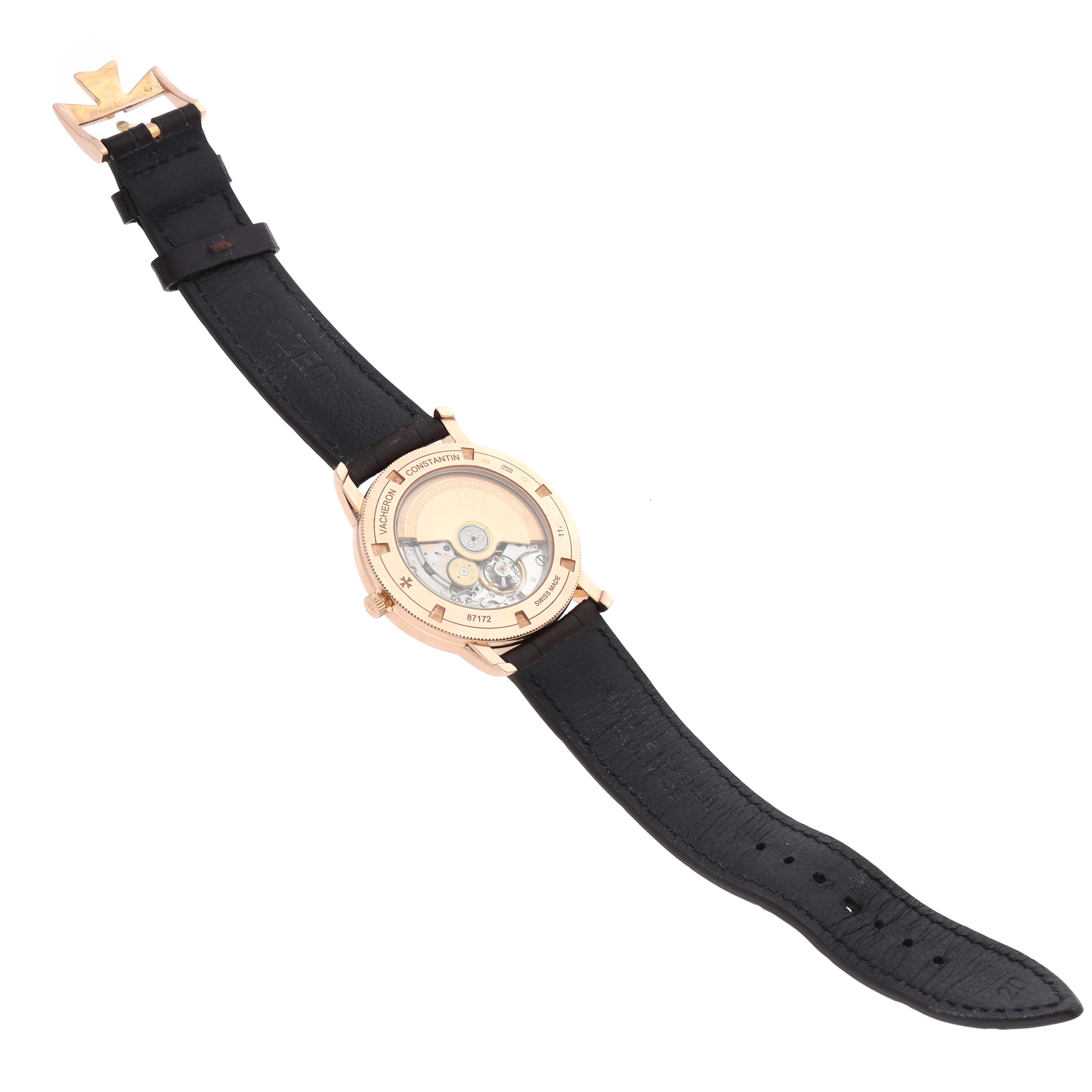The Vacheron Constantin Traditionnelle 87172 Men's Rose Gold Silver Dial watch is shown from the back, displaying its movement and leather strap.