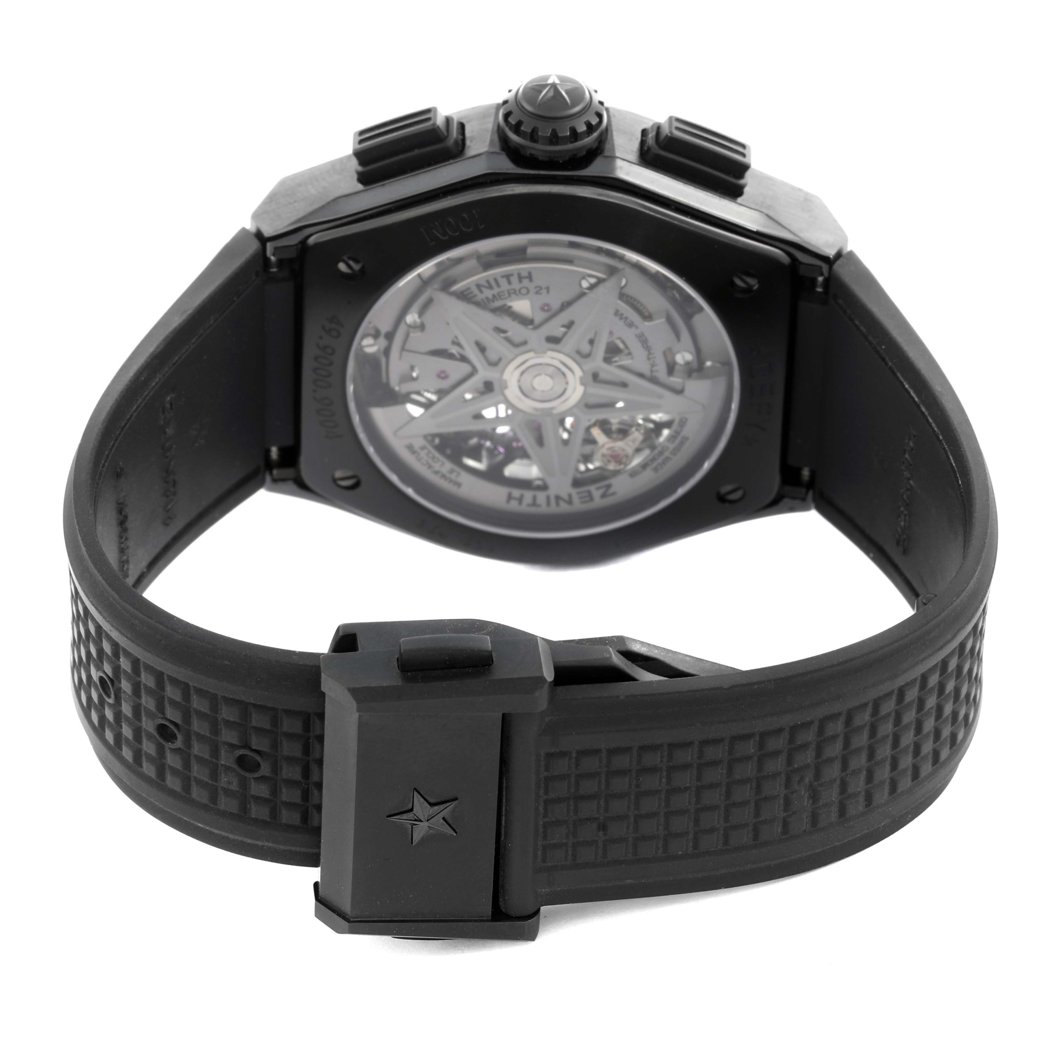 The image shows the back of the Zenith El Primero 49.9000.9004/78.R782 Men's Ceramic Black Dial 49.9000.9004/78.R782 Men's Ceramic Black Dial watch, highlighting the transparent case back and dark strap with a clasp.