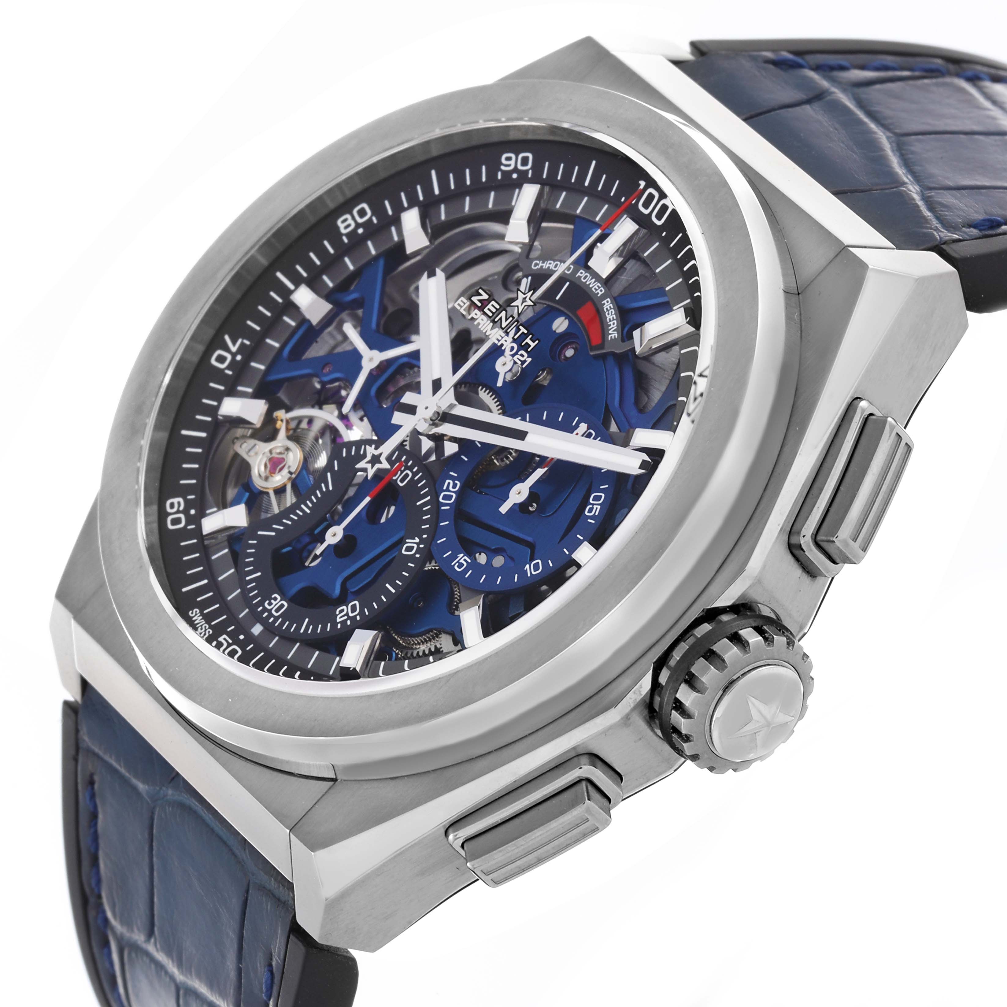 The Zenith El Primero 95.9002.9004/78.R584 Men
s Titanium Blue Dial 95.9002.9004/78.R584 Men
s Titanium Blue Dial watch is shown from a side angle, highlighting the dial, crown, and blue leather strap.