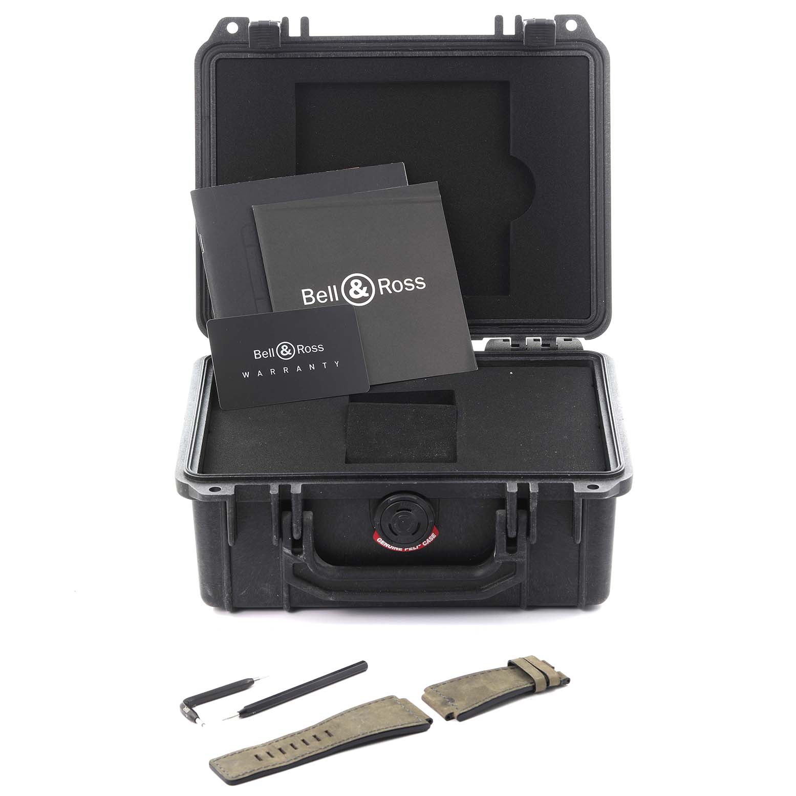 The image shows a Bell 
Ross Instruments BR03-92-DIV-B Men
s Bronze Green Dial BR03-92-DIV-B Men
s Bronze Green Dial watch case, warranty card, tools, and spare straps from a top angle.