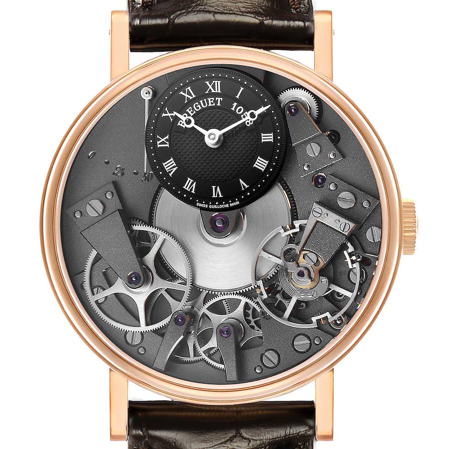 The Breguet Tradition 7027 Men's Rose Gold Grey Dial watch is shown from the front, displaying its intricate open-worked dial and visible movement components.