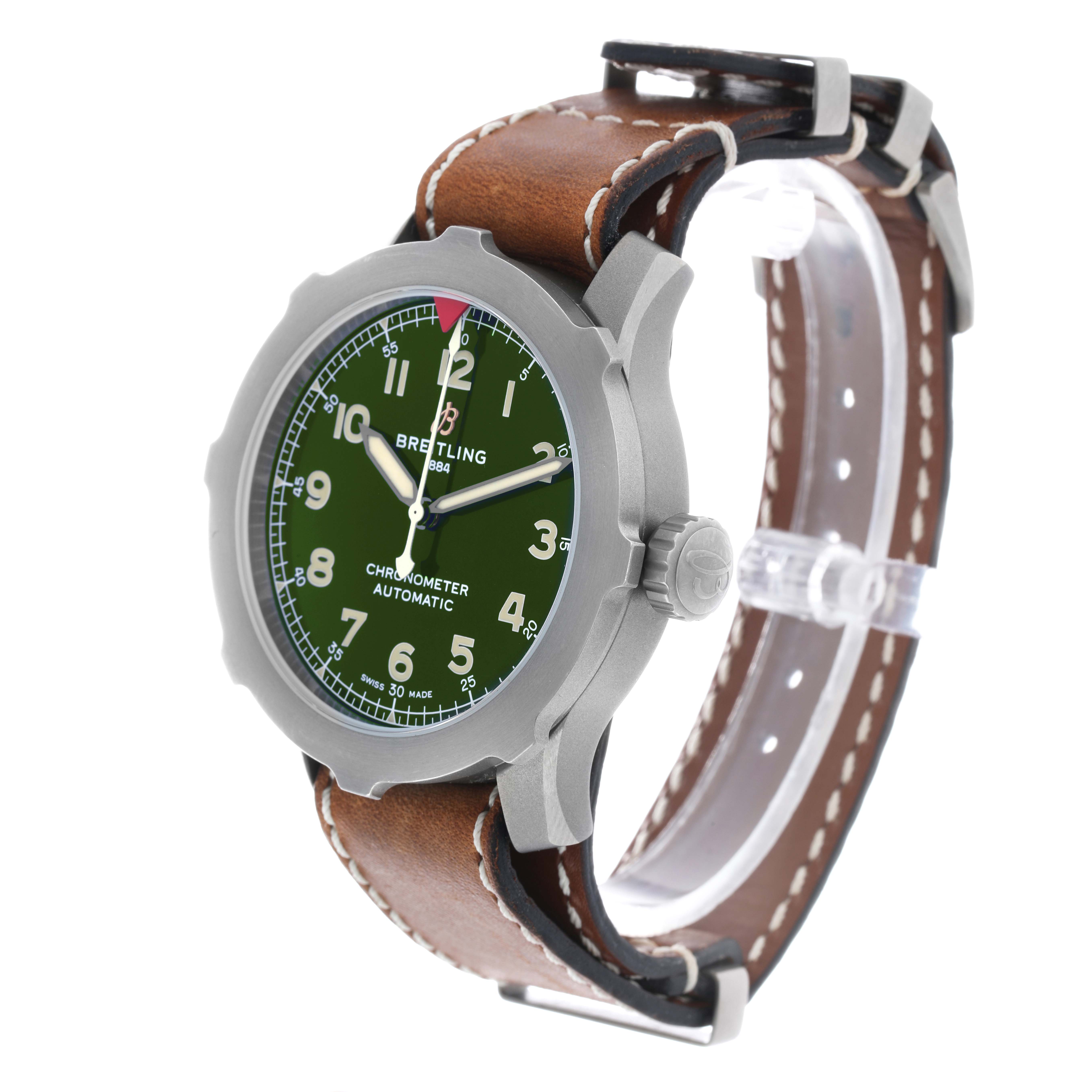 The Breitling Navitimer EB2040101L1X1 Men's Titanium Green Dial watch is shown at a three-quarter angle, highlighting its green dial, bezel, and brown leather strap.